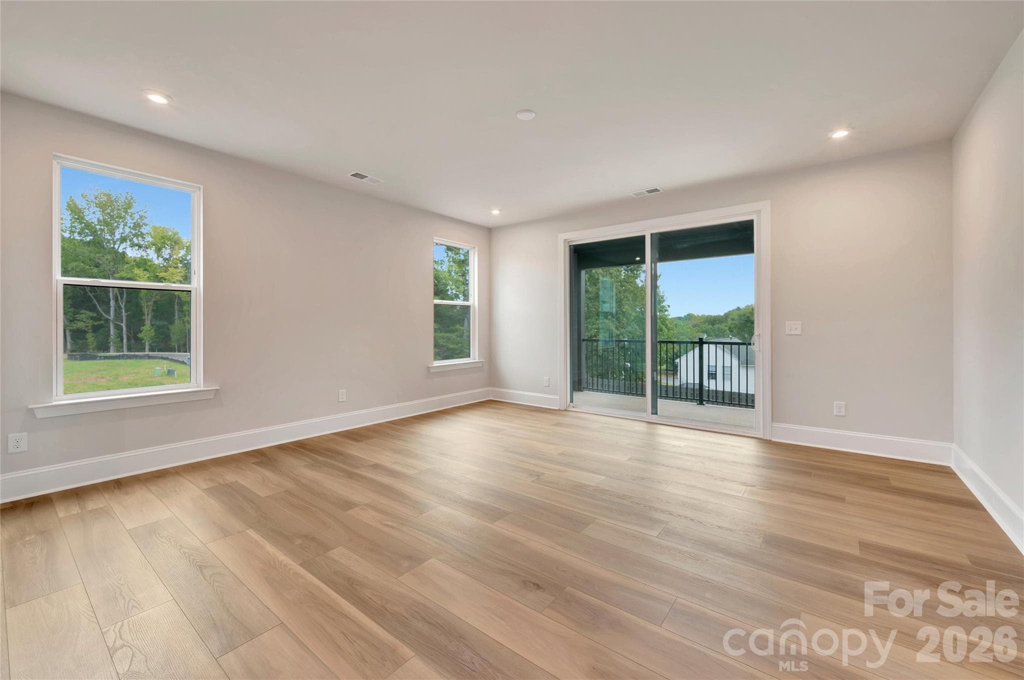 Living room with access to the covered outdoor living area - 444 Old Town Village Road, Waxhaw