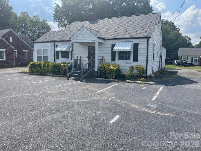 Street View with parking places (4) - entire lot is paved around the business - 1670 Dale Earnhardt Boulevard, Kannapolis