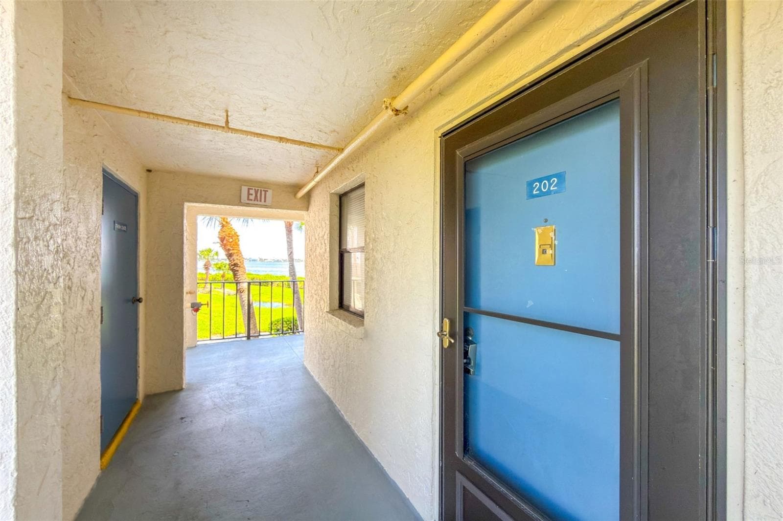 Entrance with recycle room to the left. - 1751 BEACH RD #202, ENGLEWOOD