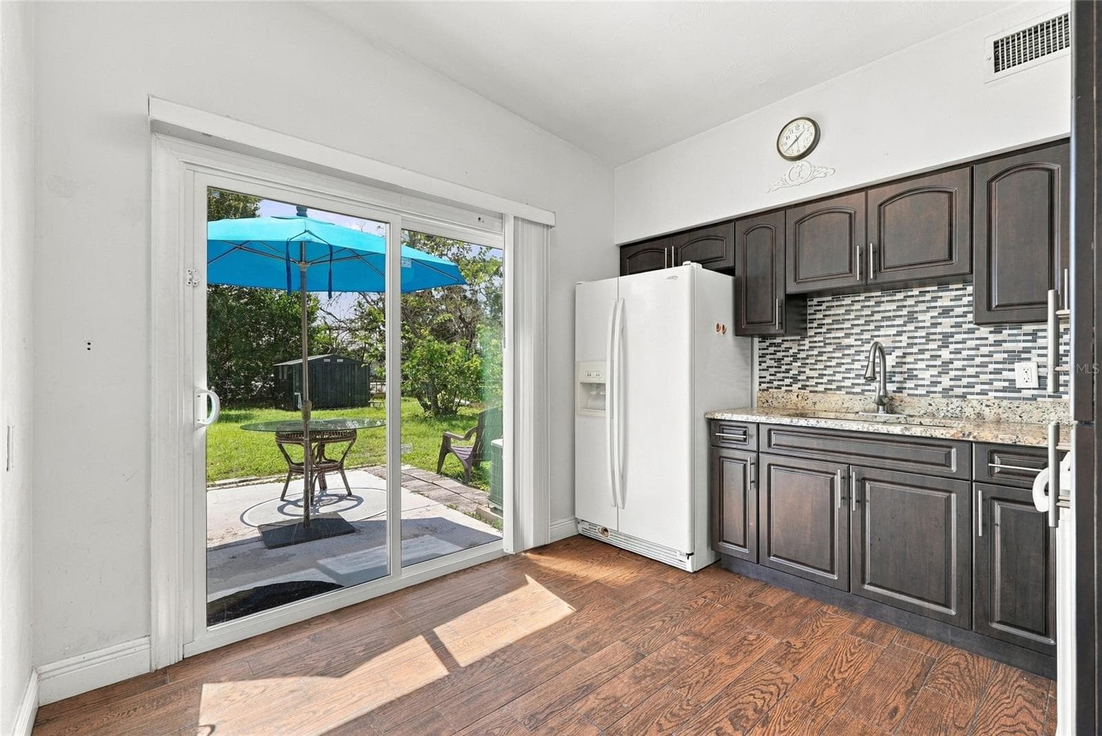 kitchen with new sliding glass door to large backyard - 10594 104TH AVE, LARGO