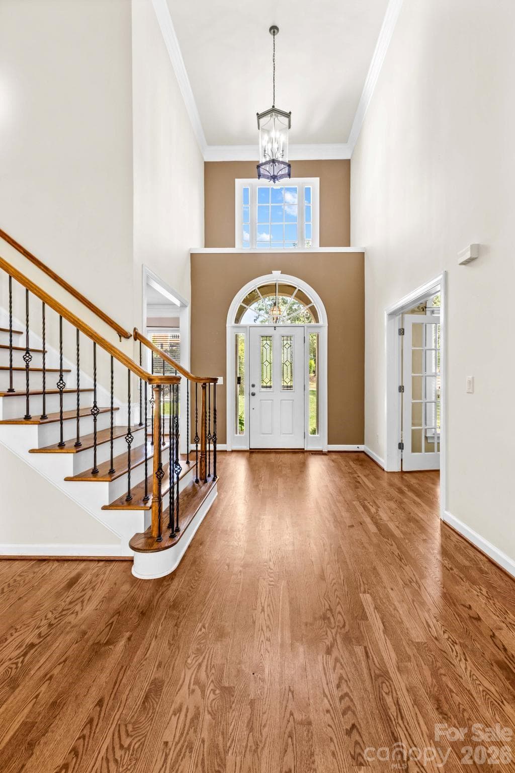Grand two-story foyer with gleaming hardwoods welcome you into the home. - 12822 Cadgwith Cove Drive, Huntersville
