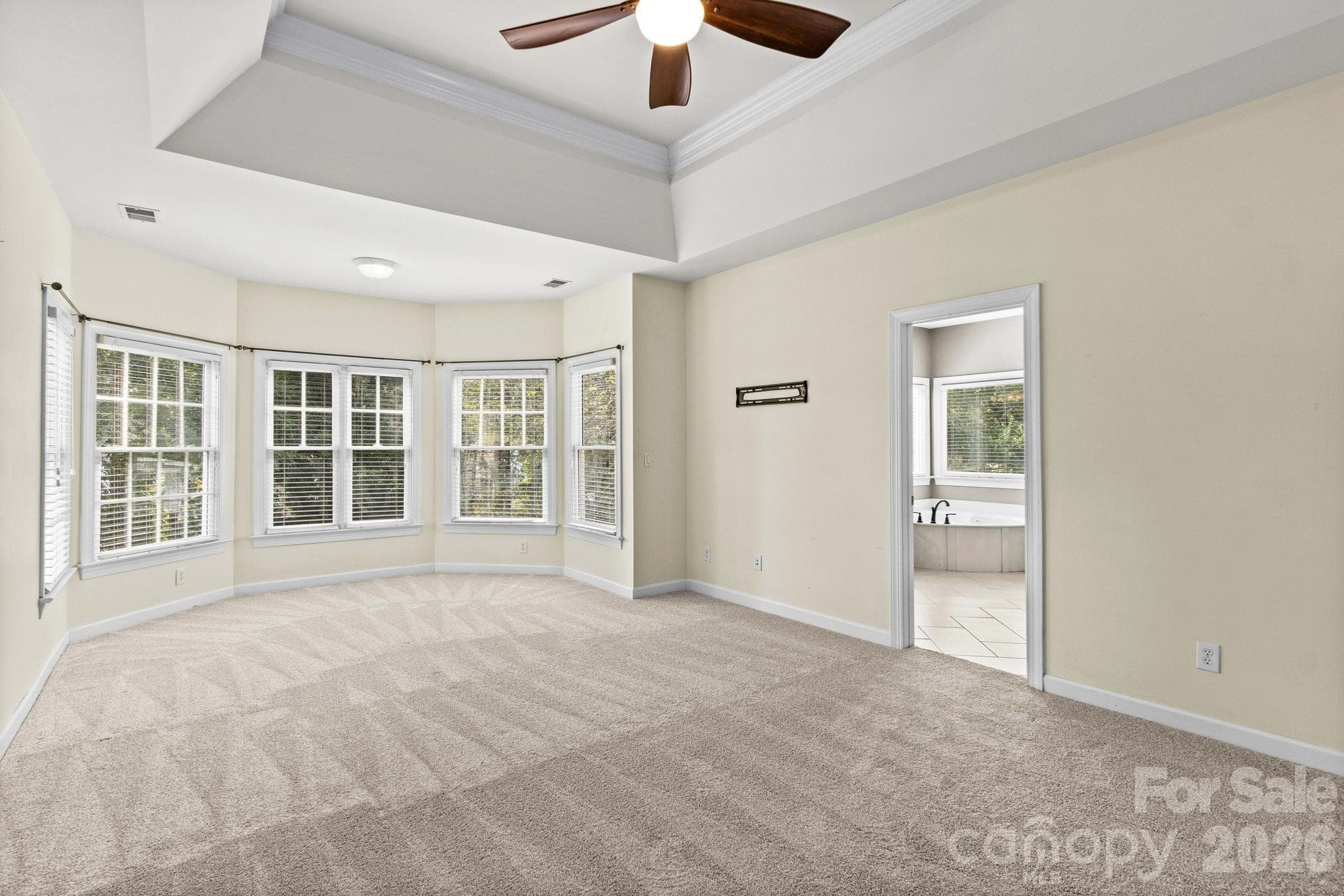 Spacious primary bedroom with a sitting area is located on second floor. - 12822 Cadgwith Cove Drive, Huntersville