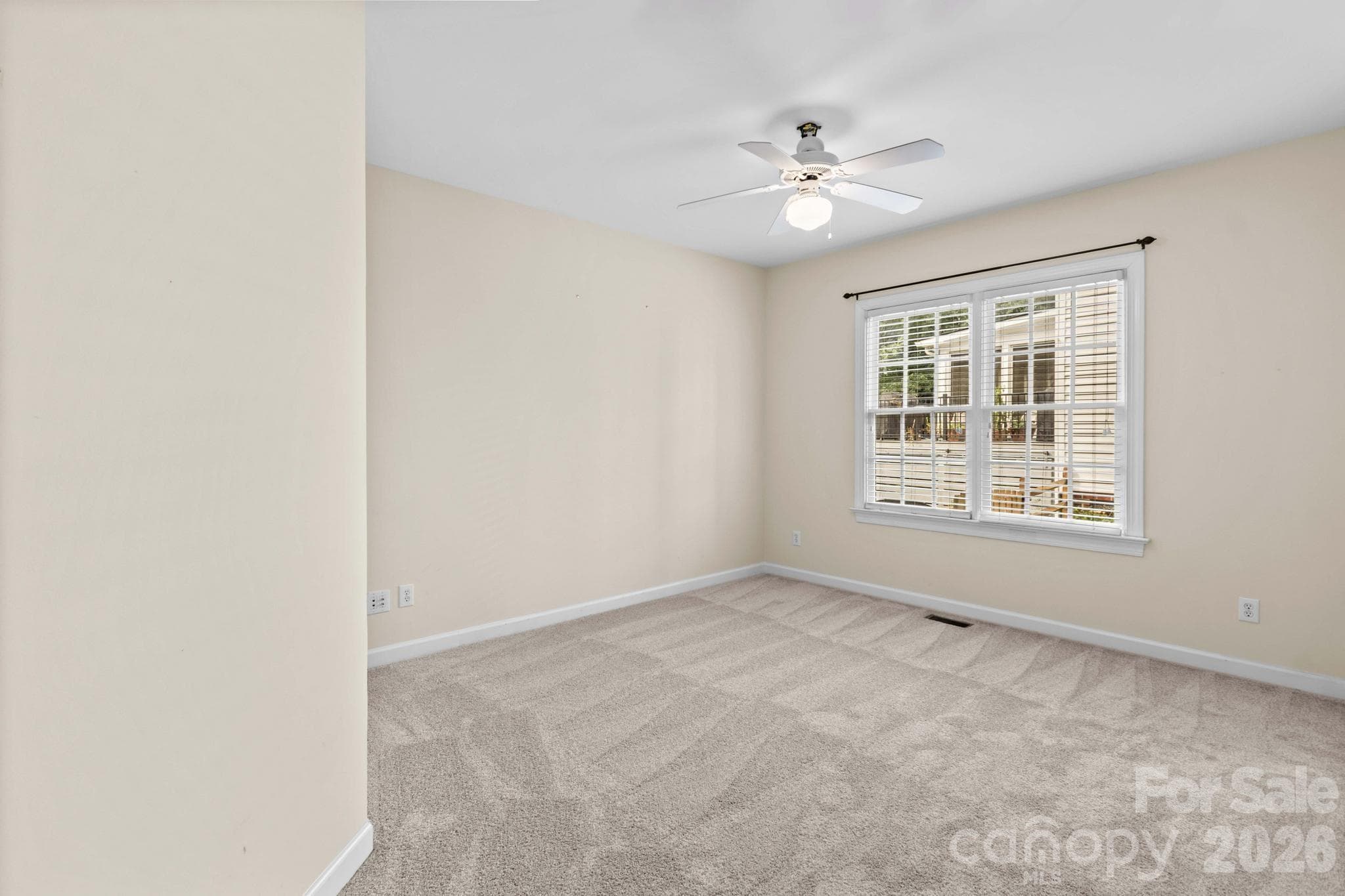 Main level ensuite bedroom #5 is ideal for overnight guests needing their own space. - 12822 Cadgwith Cove Drive, Huntersville