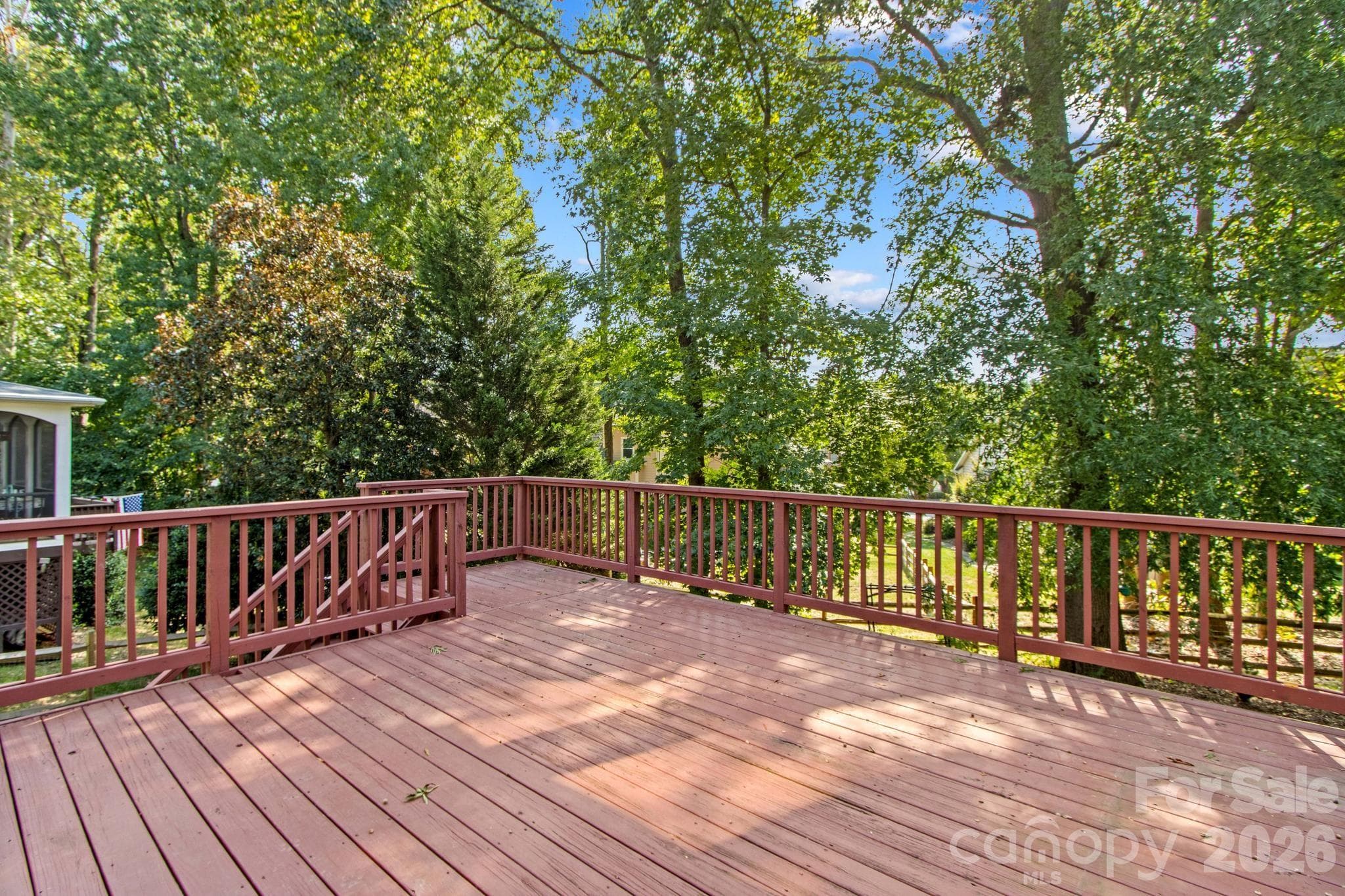 Main level wood deck is oversized and overlooks fenced yard. - 12822 Cadgwith Cove Drive, Huntersville