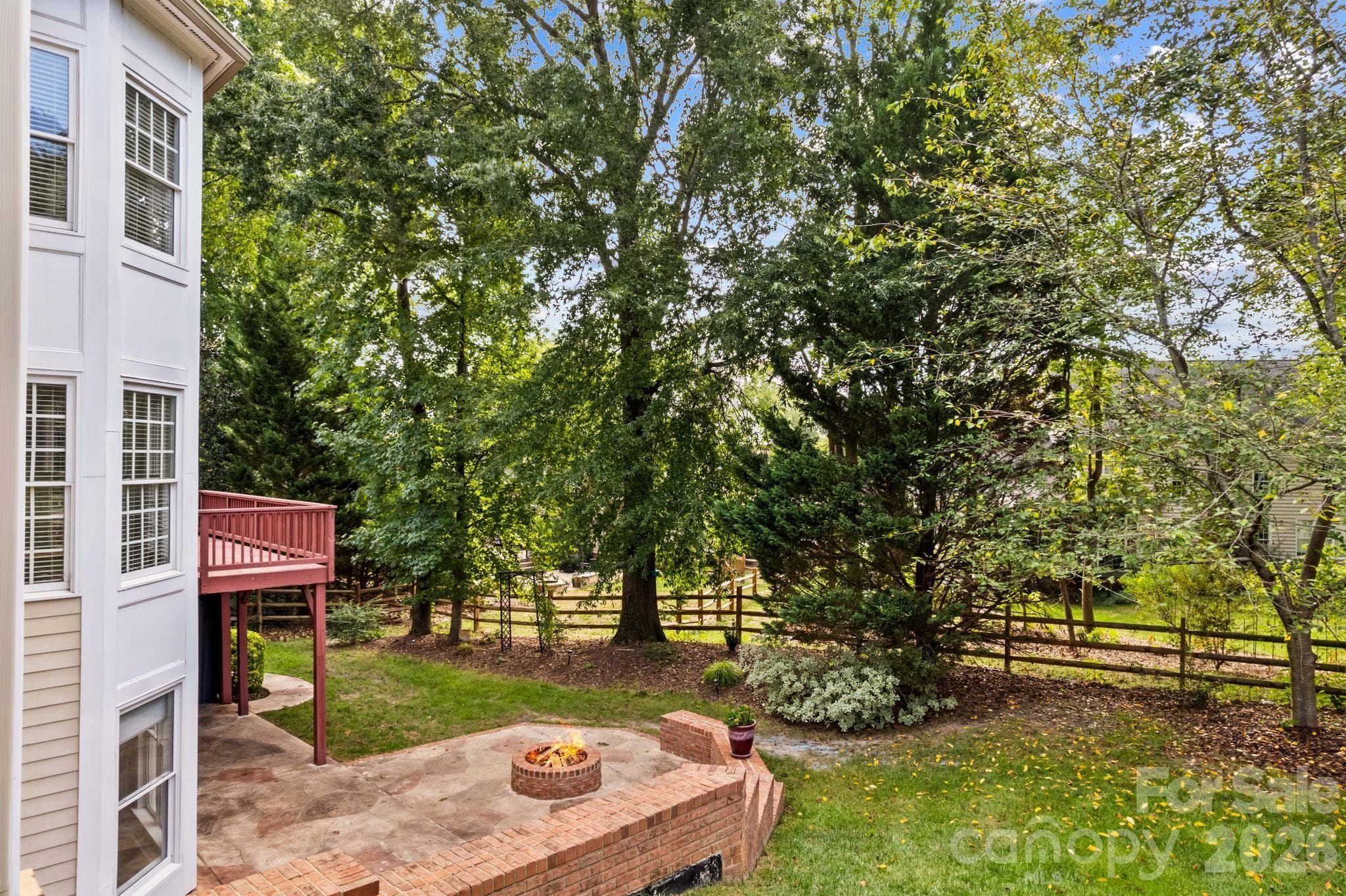 Fenced backyard has mature landscaping providing privacy. - 12822 Cadgwith Cove Drive, Huntersville