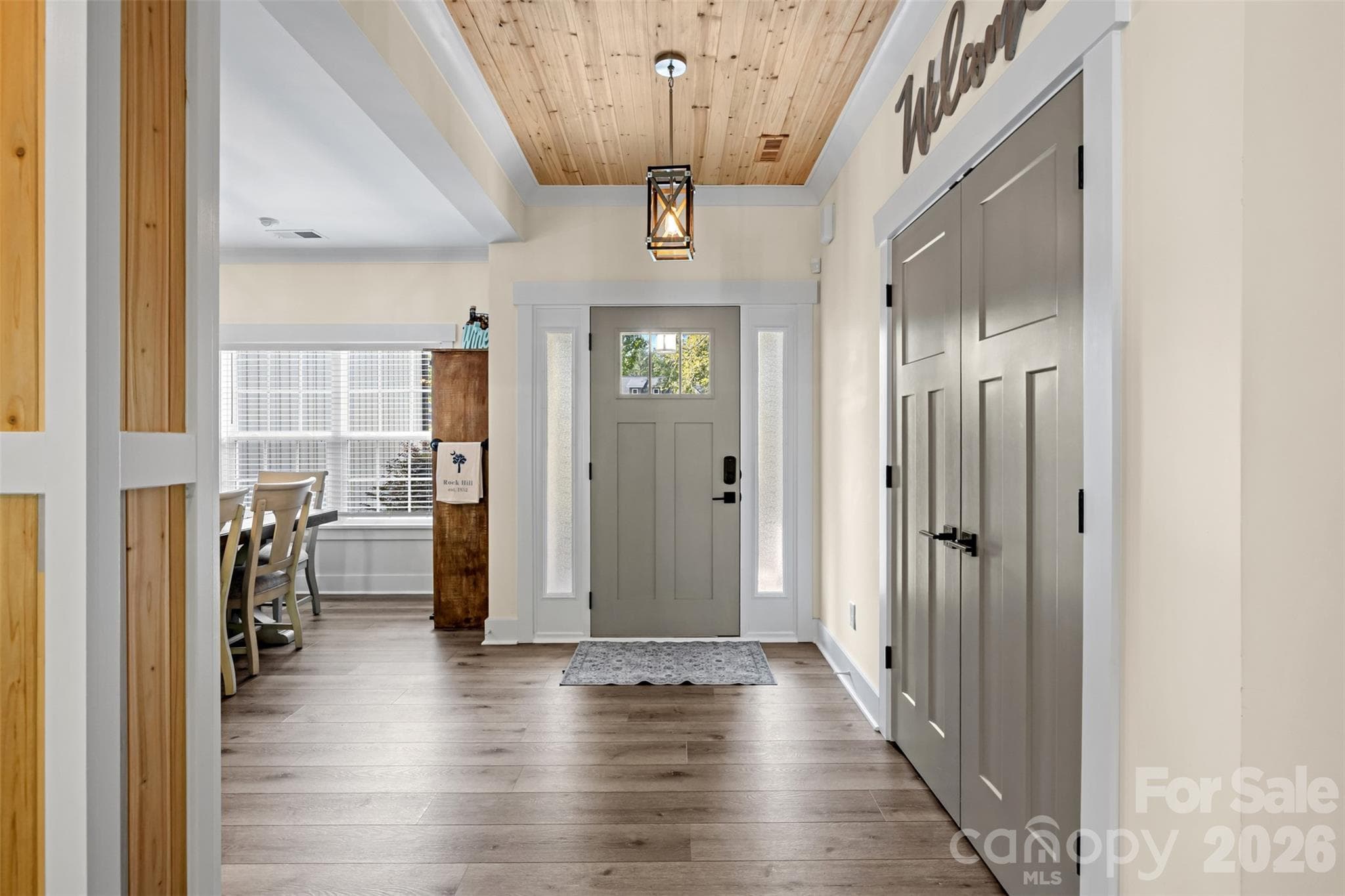 Bright entryway with custom details and warm wood accents - 1604 Aragon Beach Road, Rock Hill