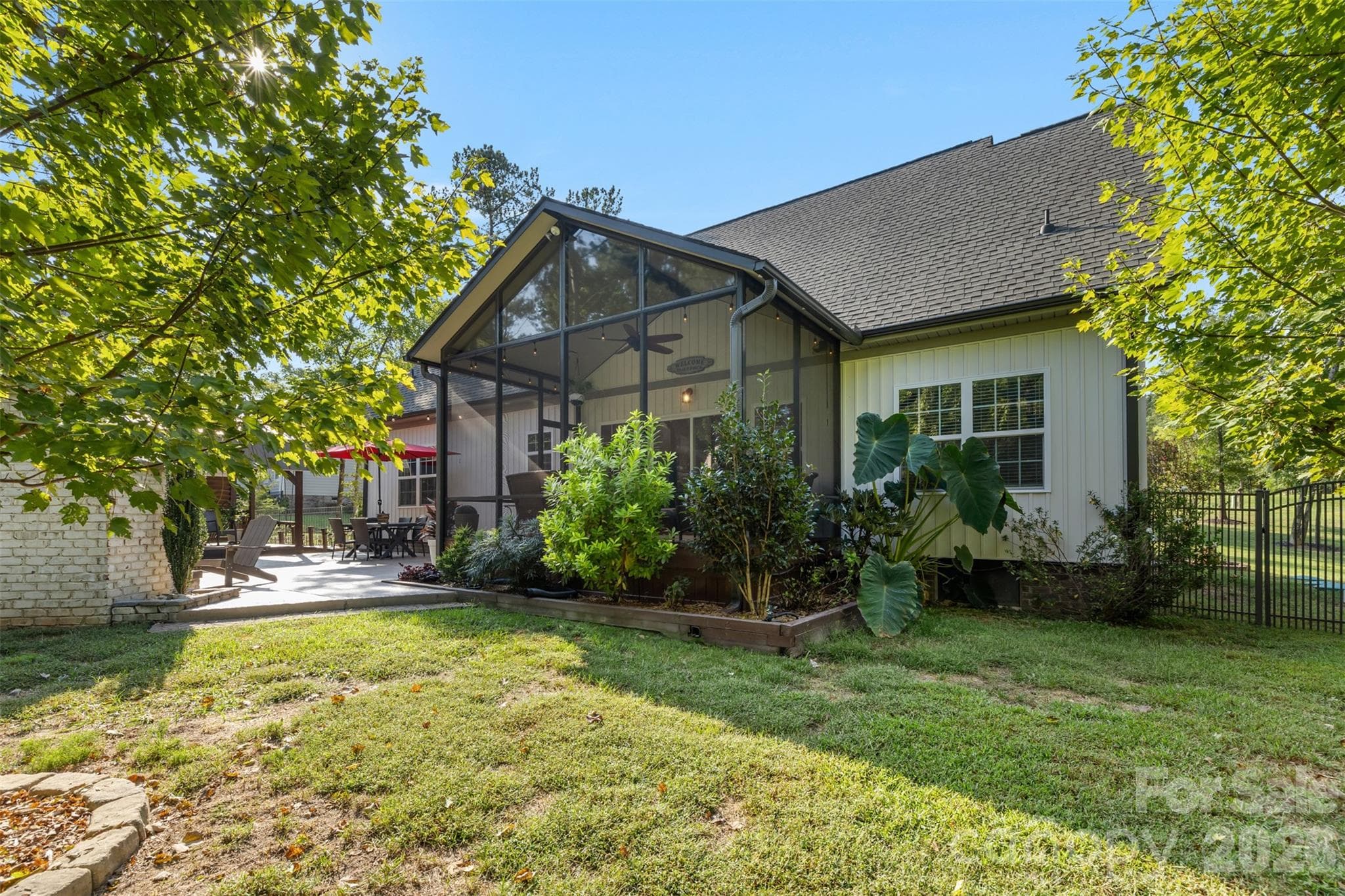 Private backyard setting overlooking woods and mature landscaping with irrigation - 1604 Aragon Beach Road, Rock Hill