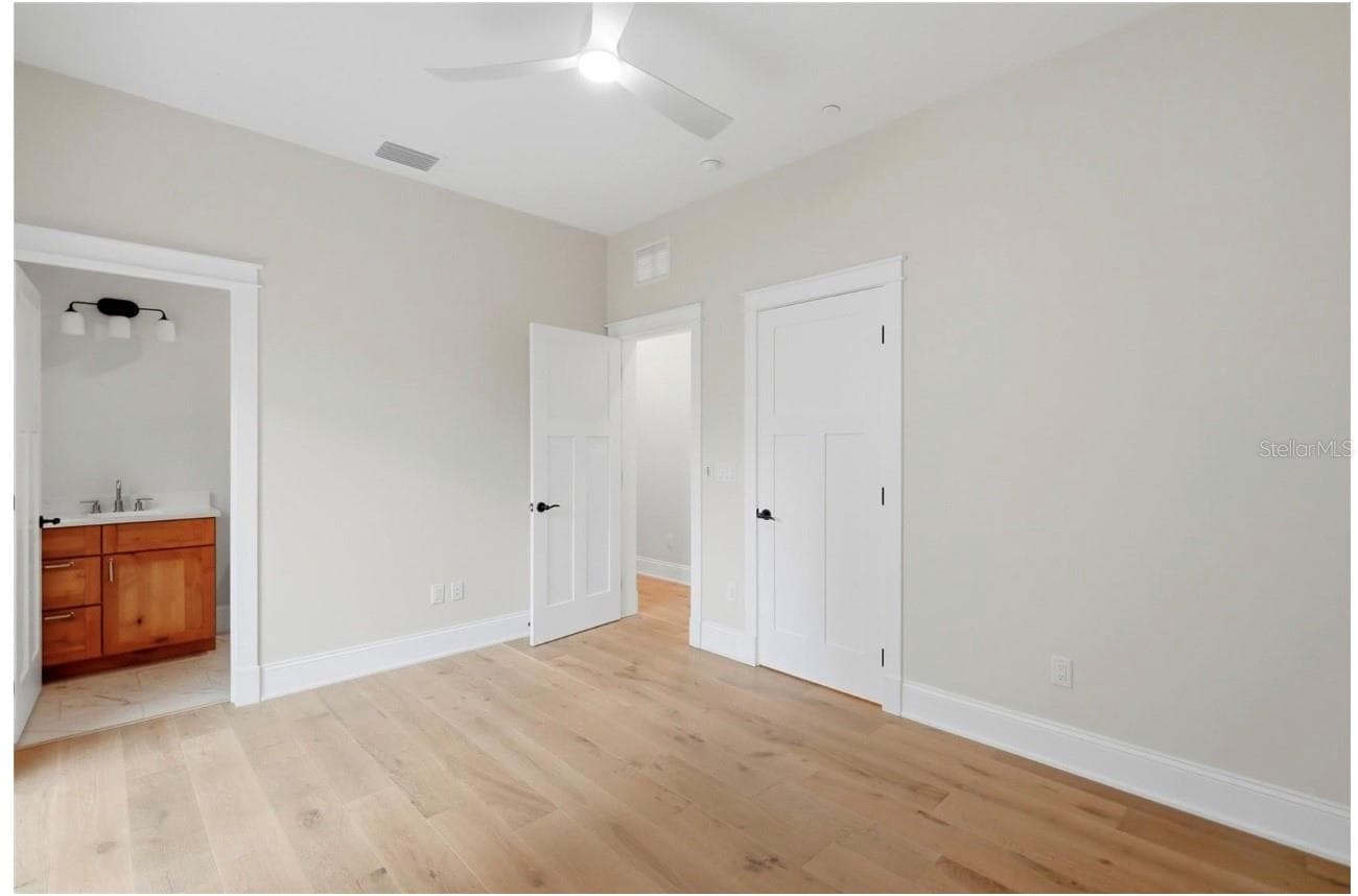 First Floor Bedroom with Ensuite and Sliding Doors to Patio - 2532 1ST AVE N, ST PETERSBURG