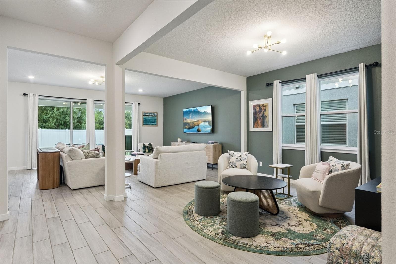 Dining and living area - 5664 OAK KNOLL DR, ST CLOUD