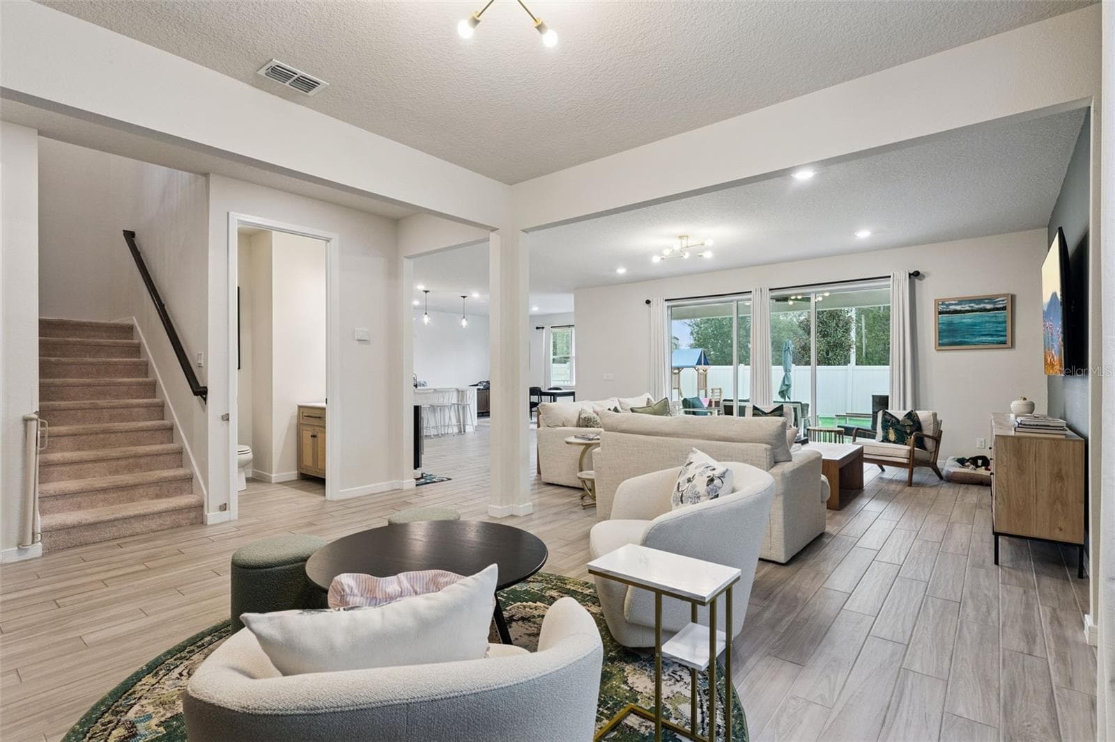 Dining and living area - 5664 OAK KNOLL DR, ST CLOUD