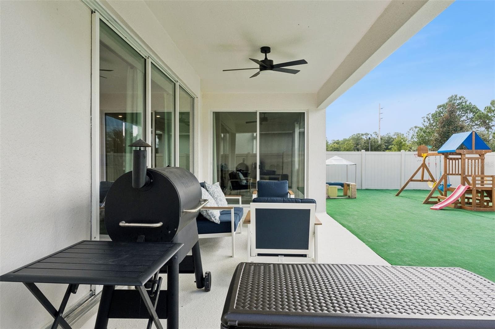Rear patio - 5664 OAK KNOLL DR, ST CLOUD