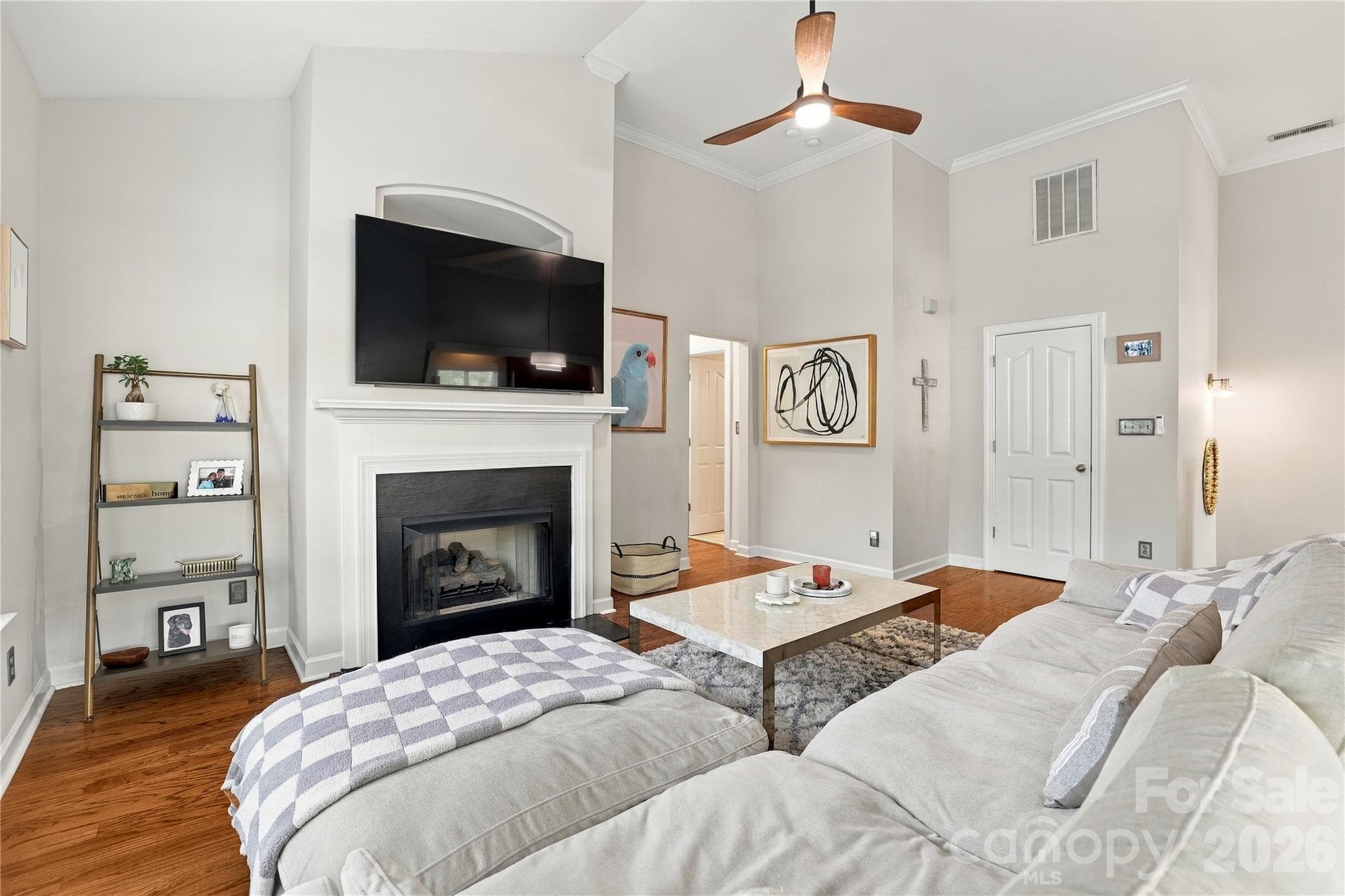 Valuted ceiling and fireplace in living room for cozy evenings - 15329 Jade Street, Charlotte