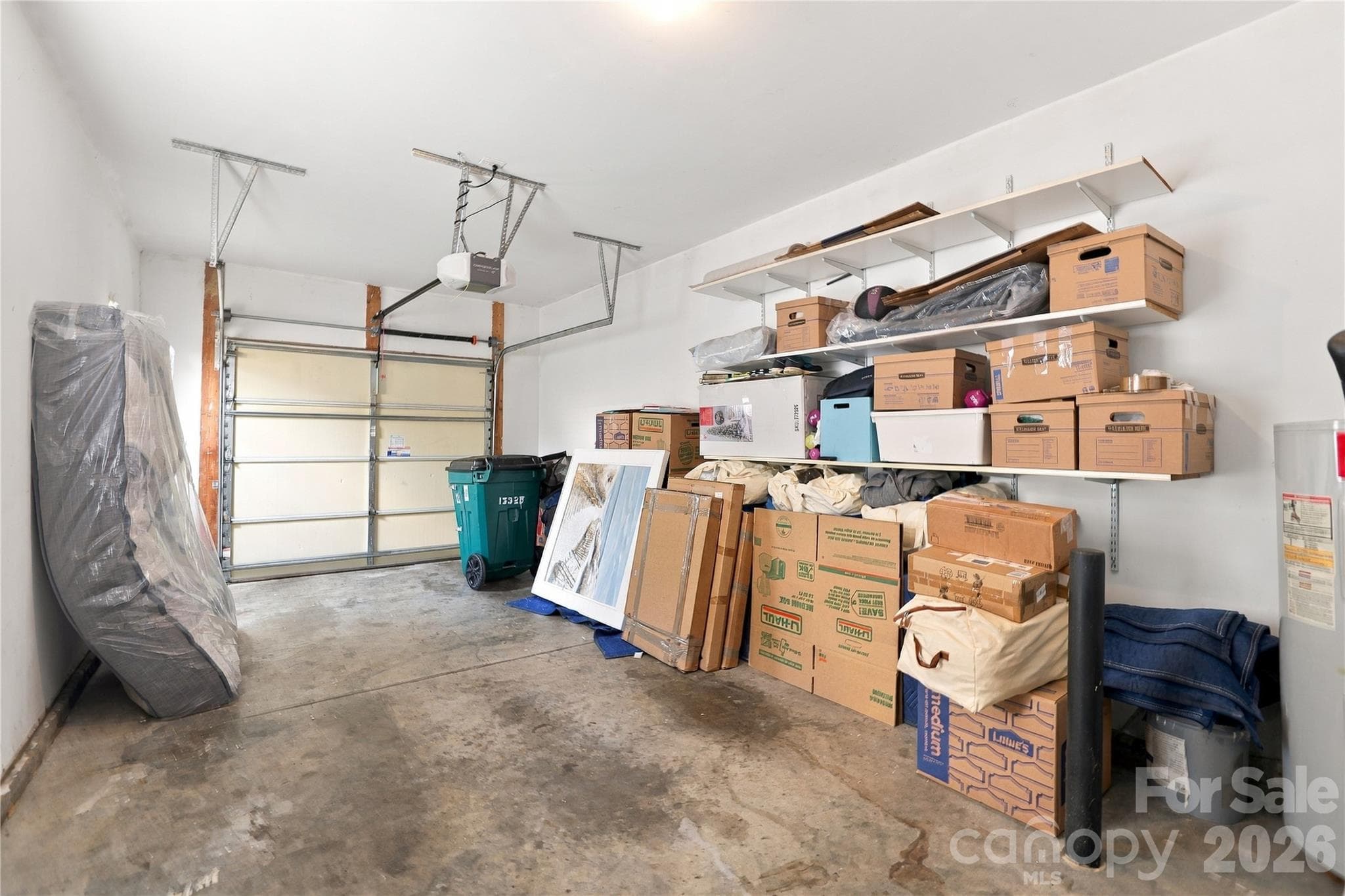 One car garage with storage shelving - 15329 Jade Street, Charlotte