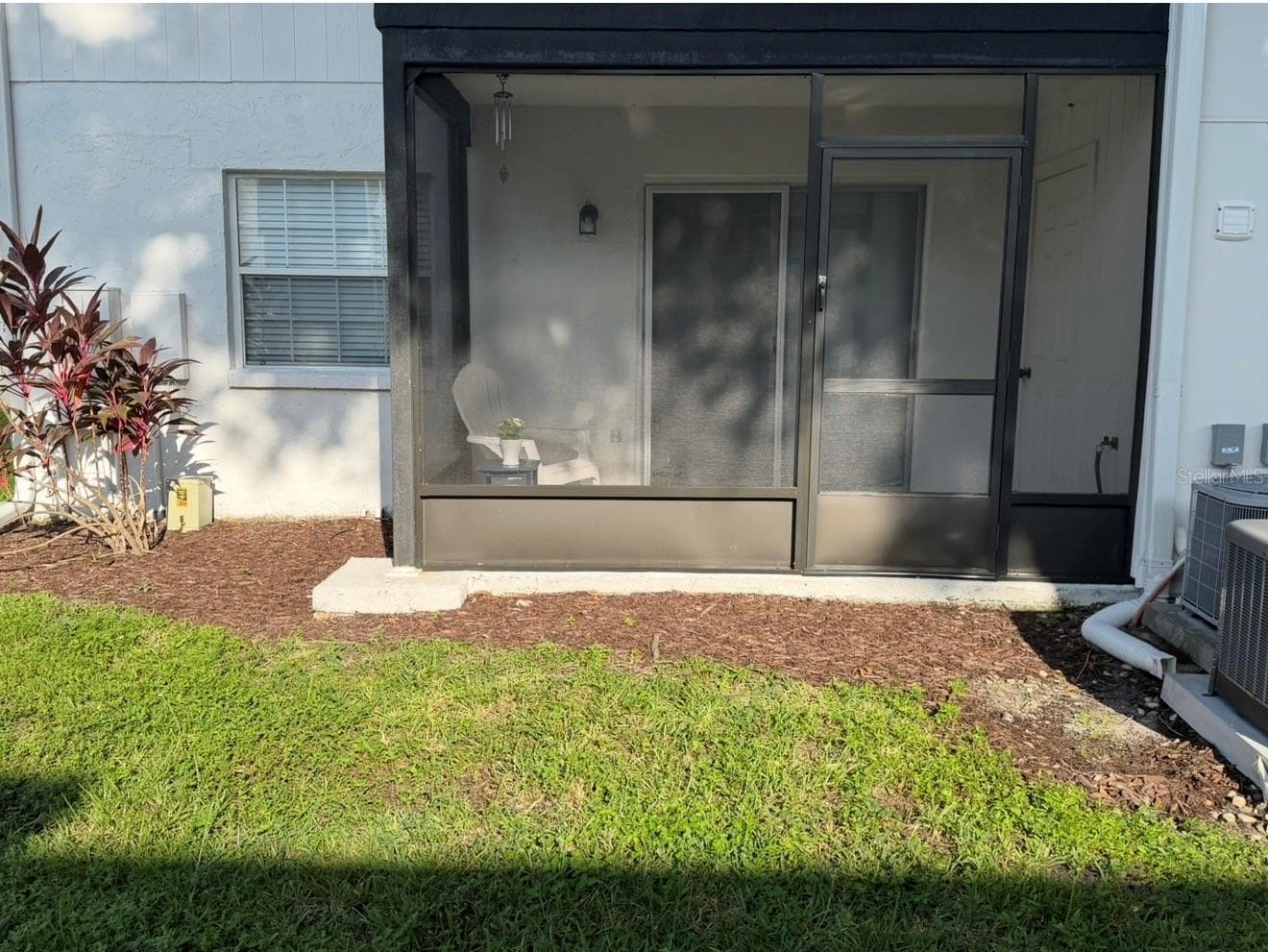 BRAND NEW Screened-in Patio installed August 2026! Fresh mulch was laid, and there's a utility closet off the porch as well as a hose and spigot. - 3815 N OAK DR #G71, TAMPA
