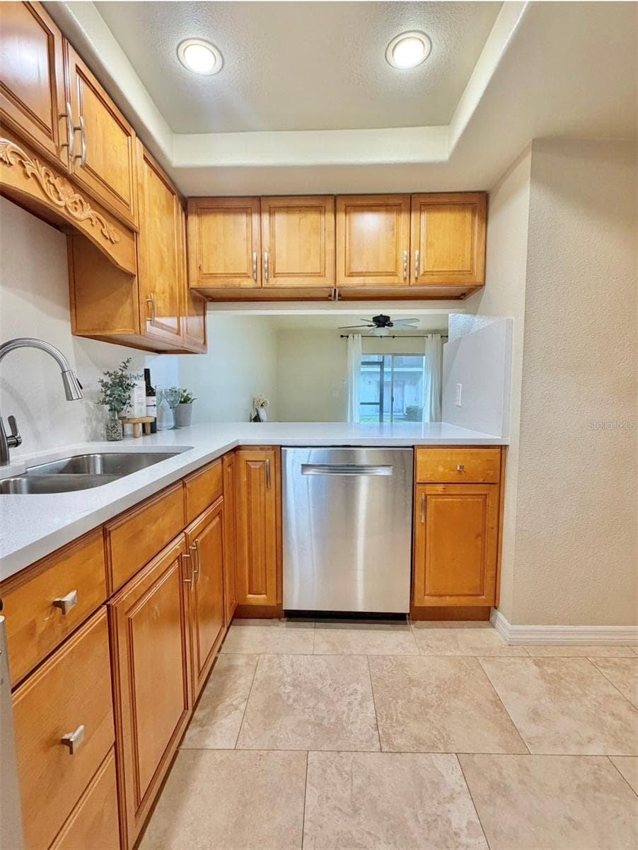 The Kitchen has an opening and bar space to the living room. - 3815 N OAK DR #G71, TAMPA