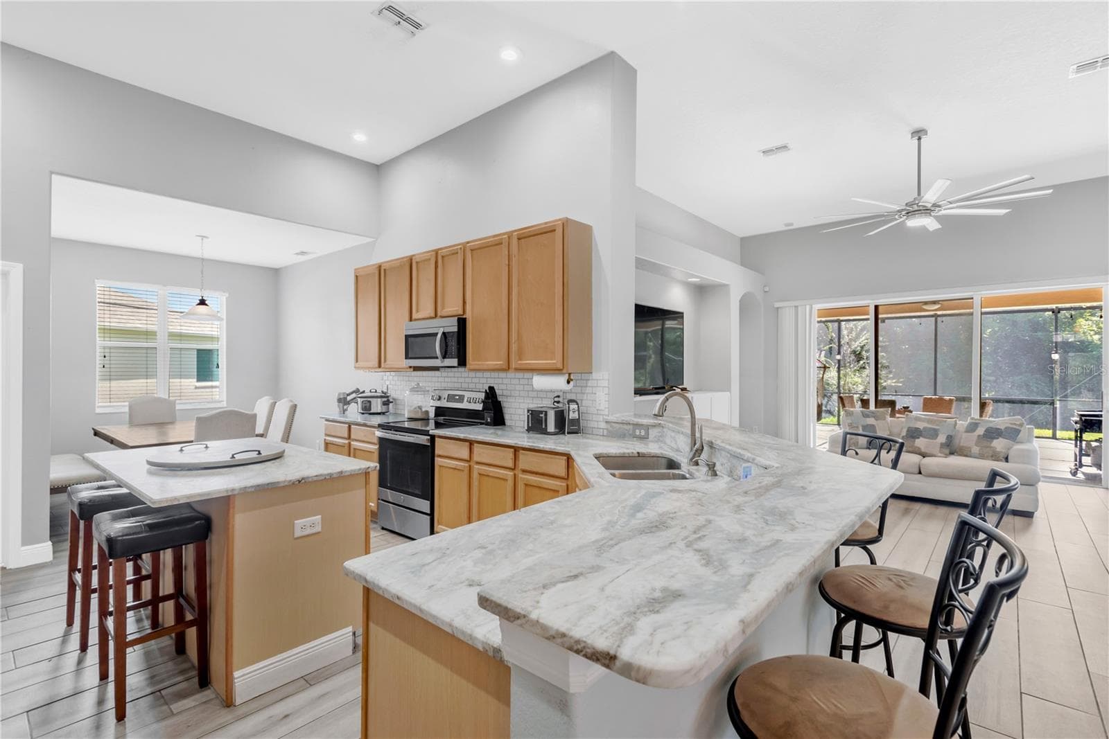 Open Kitchen with leathered countertops - 31230 ALCHESTER DR, WESLEY CHAPEL