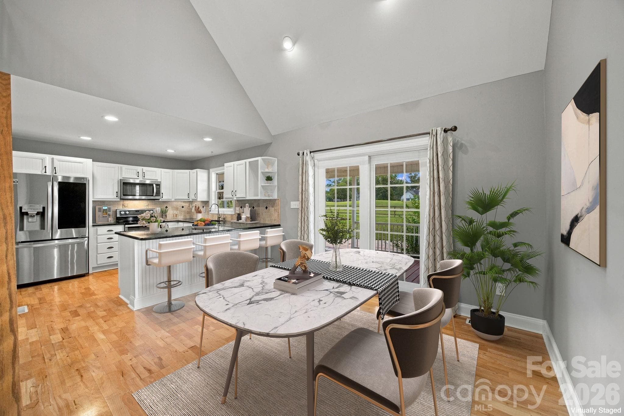 Virtually staged to showcase the breakfast area overlooking the backyard and golf course. - 122 Wood Duck Loop, Mooresville