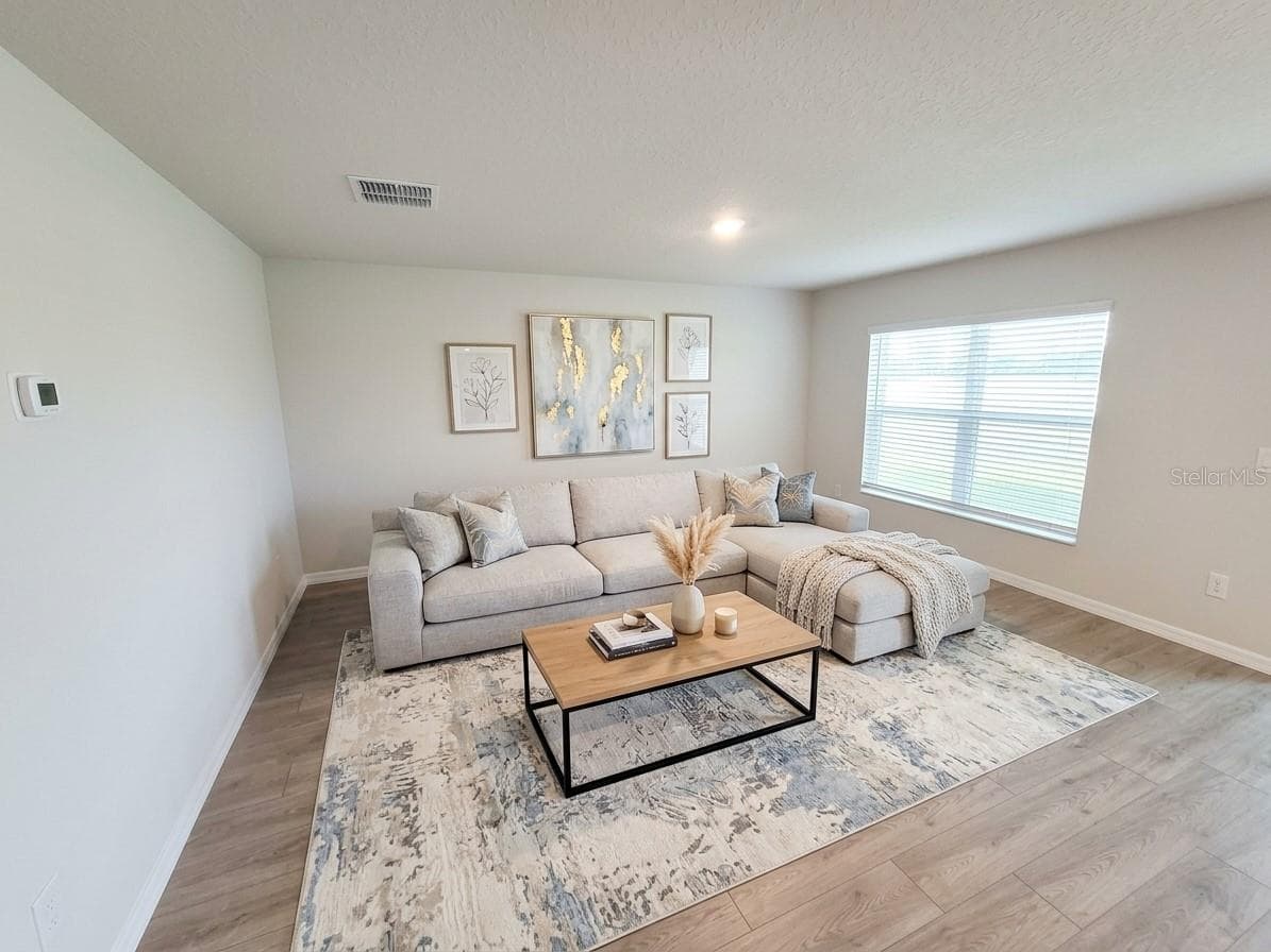 LIVING ROOM AI STAGED - 11904 MOUNTAIN ISLAND TRL, PARRISH