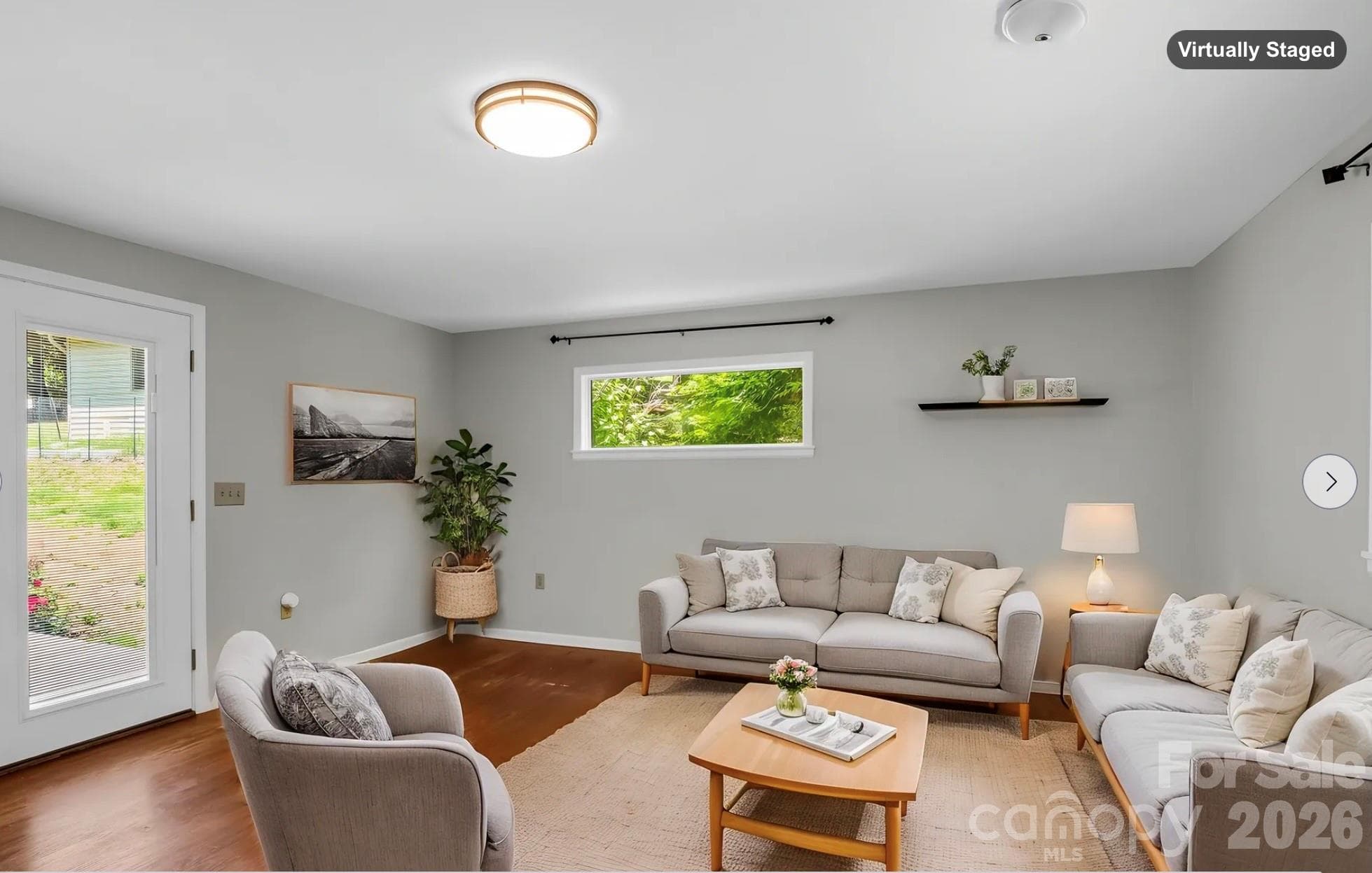 Family Room off of Living Room, doors open to back patio (virtually staged) - 35 Chastain Hill Road, Mills River