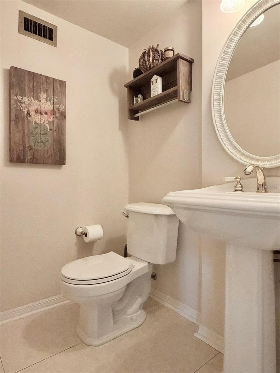 There is a half bathroom downstairs for guests to use. - 4603 DOGWOOD HILLS CT, BRANDON