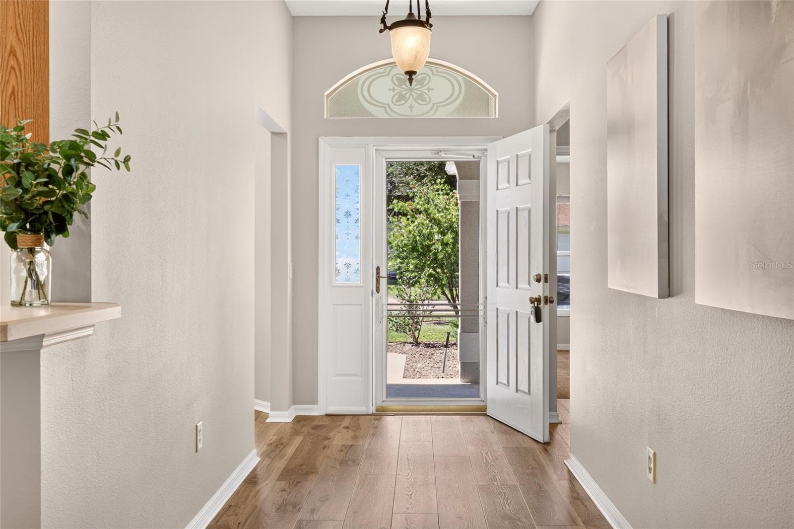 Screen door, Luxury vinyl plank flooring in main home - 17101 SE 94TH BERRIEN CT, THE VILLAGES