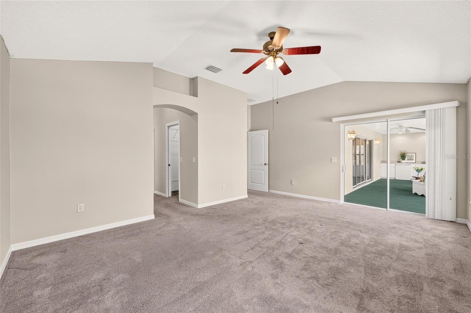 Primary Bed leading to lanai or en-suite bath - 17101 SE 94TH BERRIEN CT, THE VILLAGES