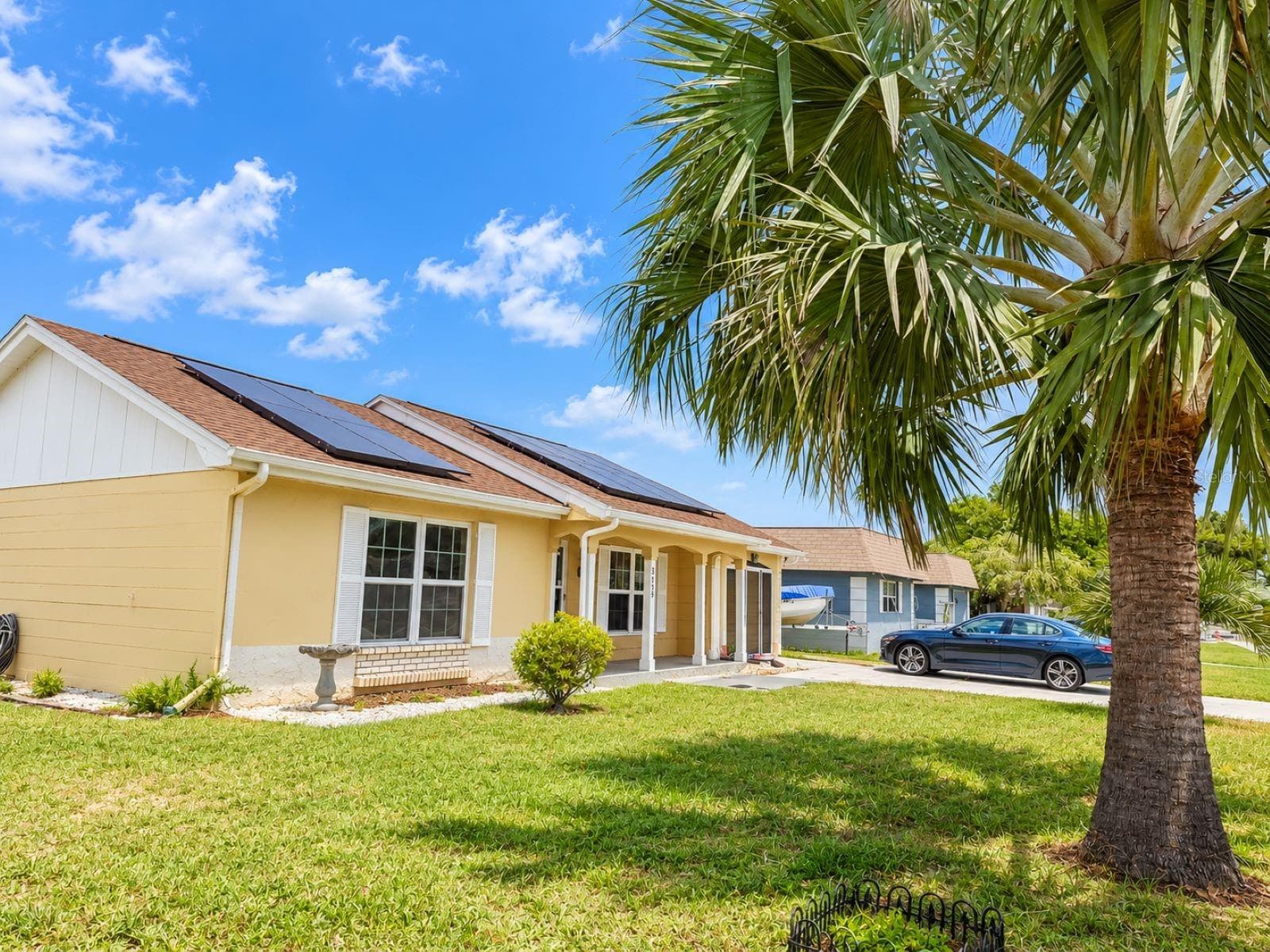 Virtual enhance: grass look greener and healthier, refresh and brighten the exterior paint:ROOF IS NEW 2026 - 3153 MOOG RD, HOLIDAY