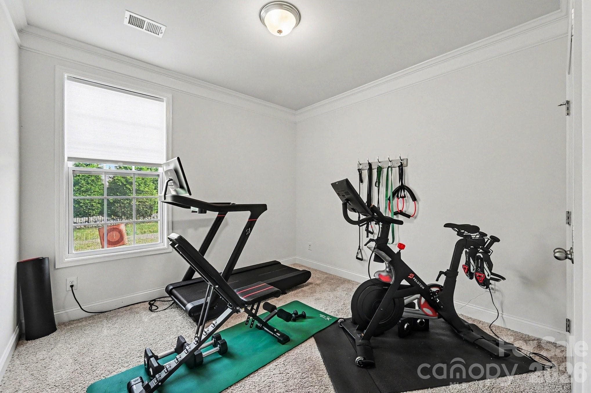 Main-level bedroom currently used as a home gym - 5710 Rainbow Lane, Indian Land