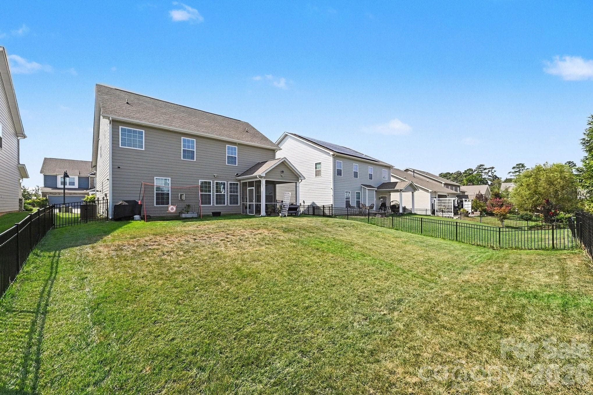 Fully fenced backyard with plenty of space for gardening, play, pets, and outdoor enjoyment - 5710 Rainbow Lane, Indian Land