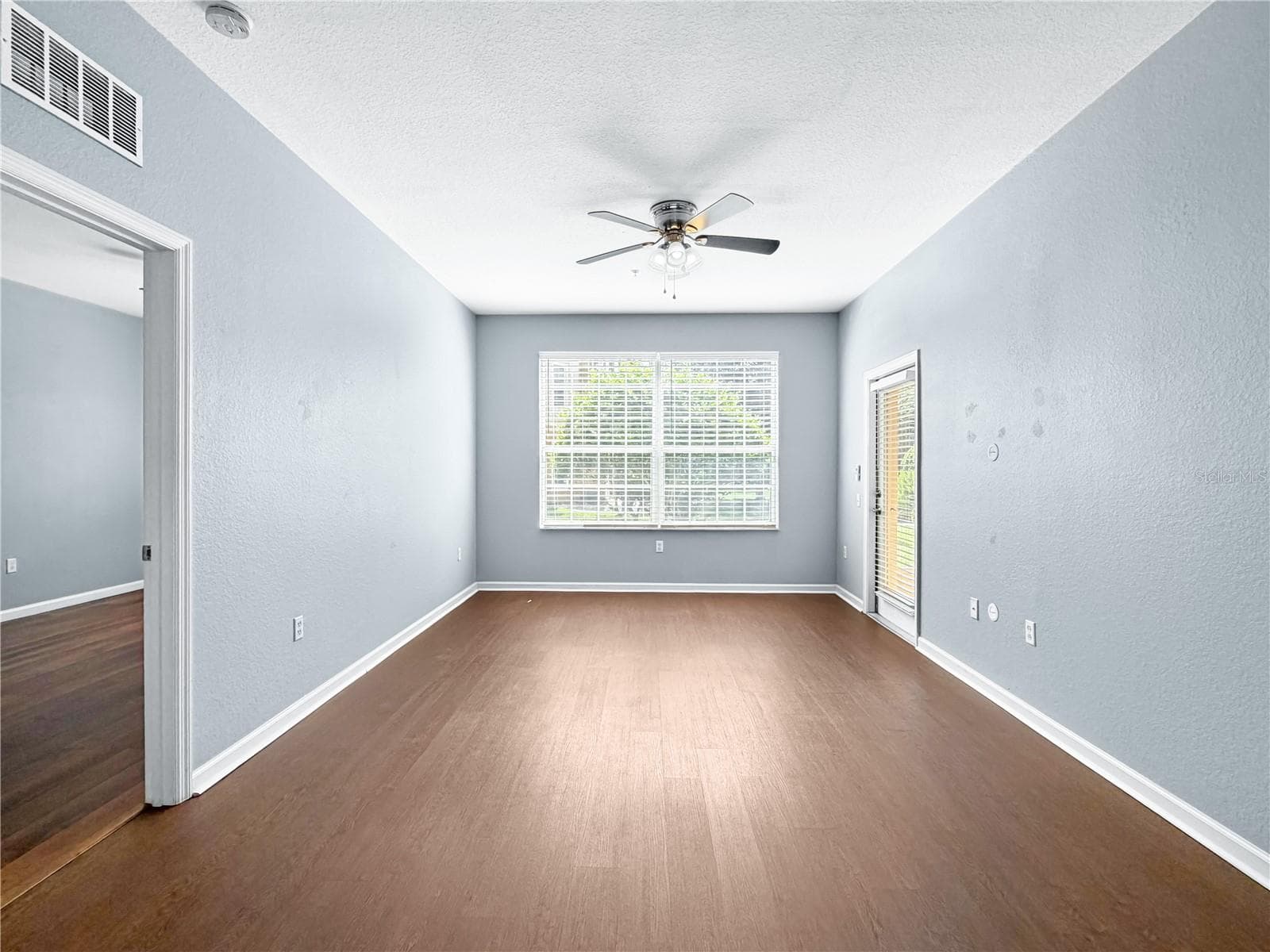 Living Room and Dining Room View from Kitchen. - 6434 CAVA ALTA DR #105, ORLANDO