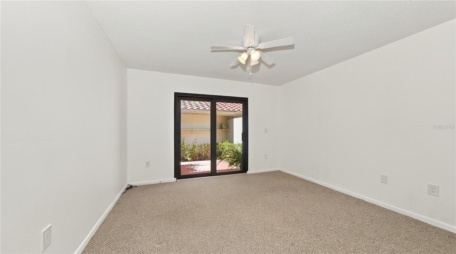 2nd Bedroom at the front of the house with porch. - 4802 KESTRAL PARK CIR #22, SARASOTA