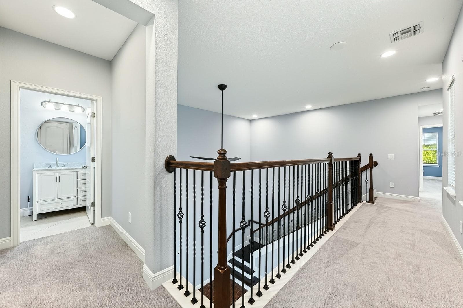 Second floor landing, catwalk views to the main floor. - 14061 WALCOTT AVE, ORLANDO