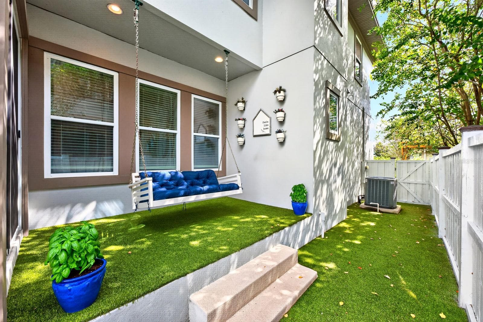 Low maintenance patio, privacy fenced sideyard finished with turf. - 14061 WALCOTT AVE, ORLANDO