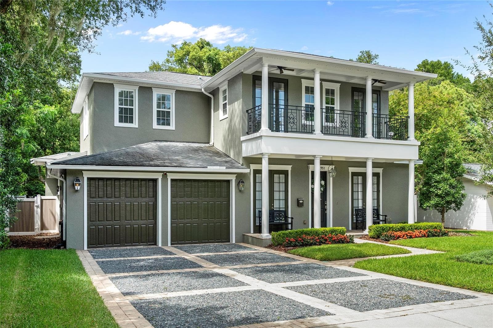 The design features large porches with ceiling fans and sweeping views. - 1951 WINTER PARK RD, WINTER PARK