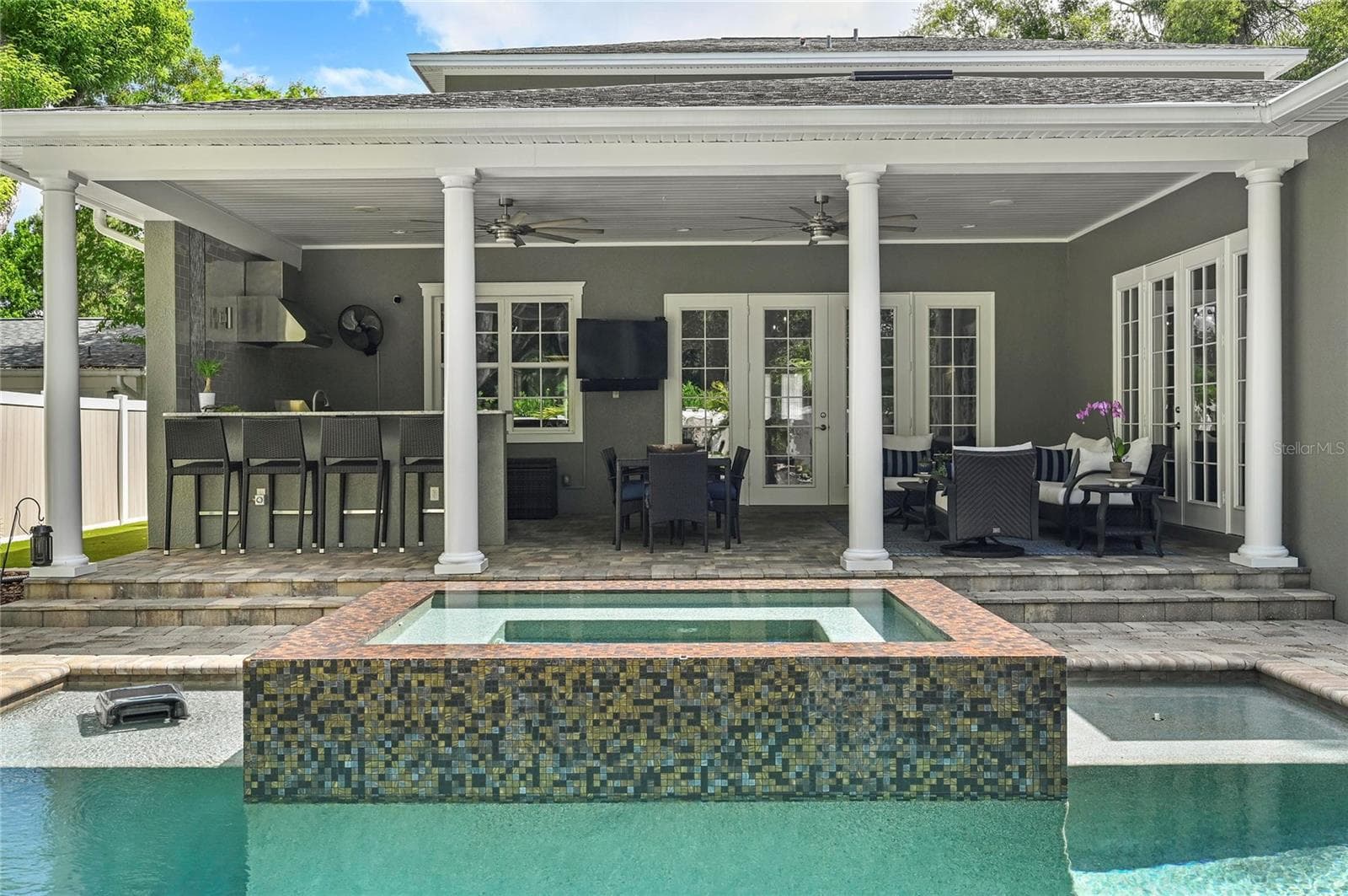 Accented by fire pits, the zen pool design makes lingering on the porch a delight. - 1951 WINTER PARK RD, WINTER PARK