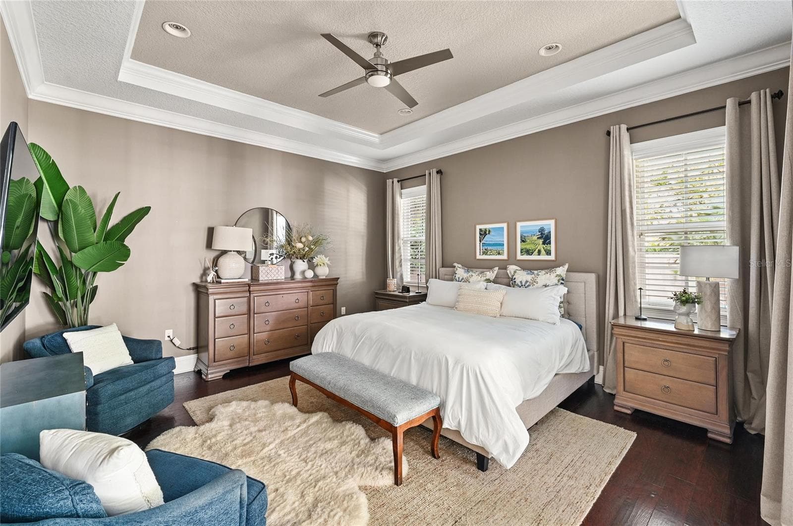 The spacious primary bedroom echos the high ceilings and finishes in the main living areas. - 1951 WINTER PARK RD, WINTER PARK