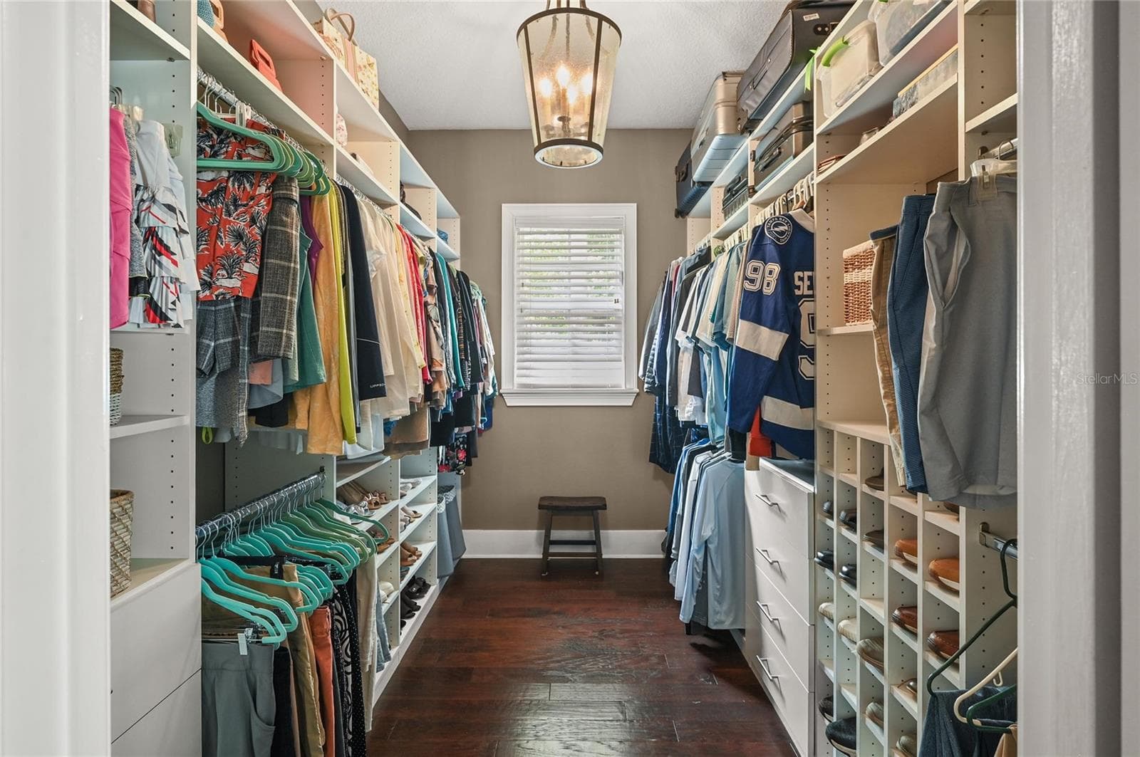 Another space made large by the natural light, high ceilings, and organizers, the primary closet checks all the boxes. - 1951 WINTER PARK RD, WINTER PARK