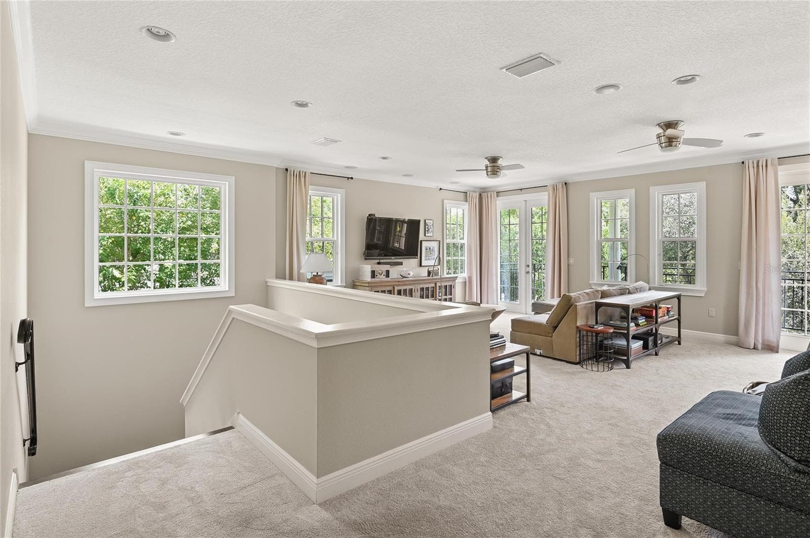 The upstairs loft feels as light, bright, and open as the main living areas. - 1951 WINTER PARK RD, WINTER PARK