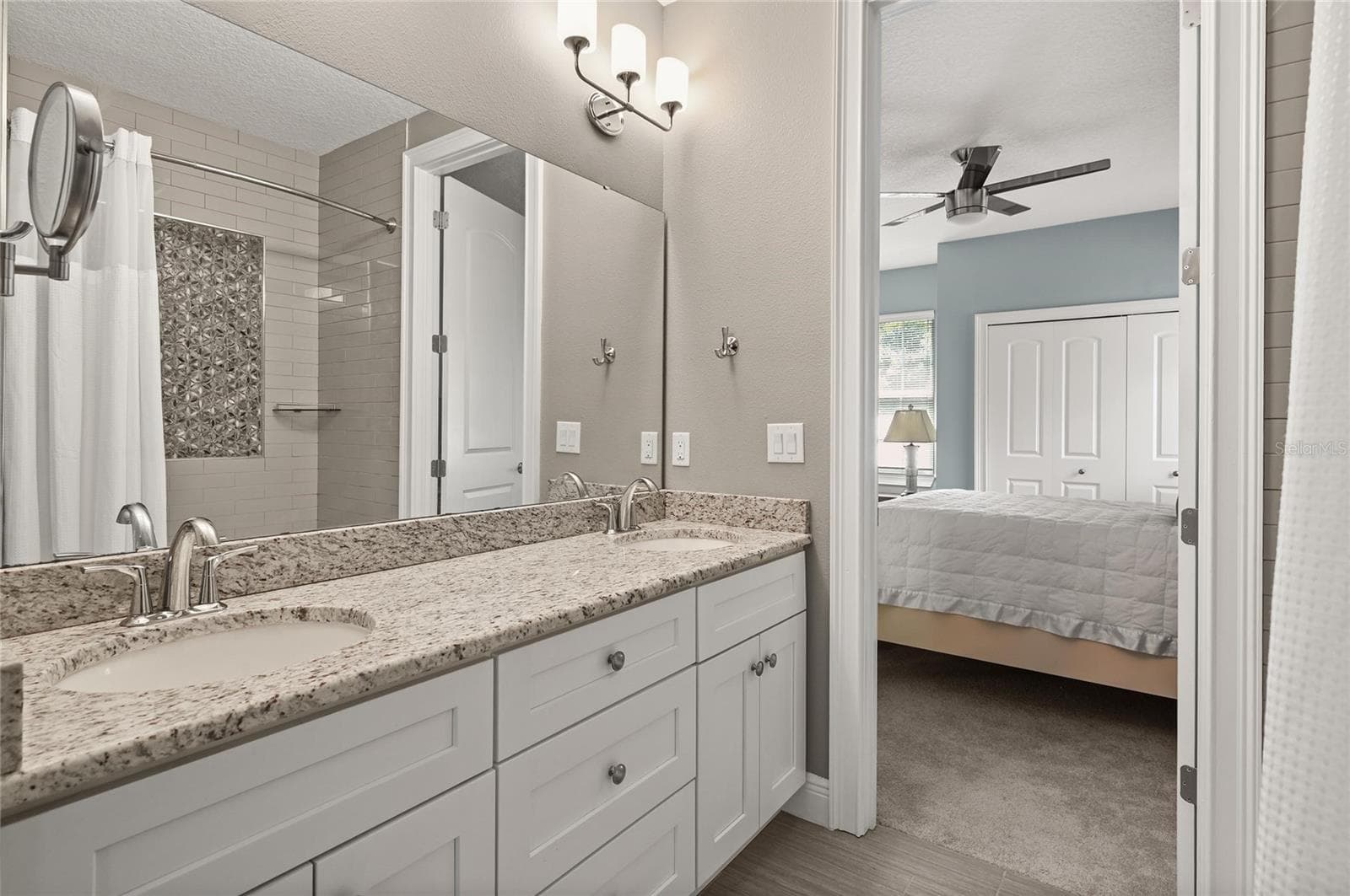 The bathroom features double sinks and a linen storage closet. - 1951 WINTER PARK RD, WINTER PARK