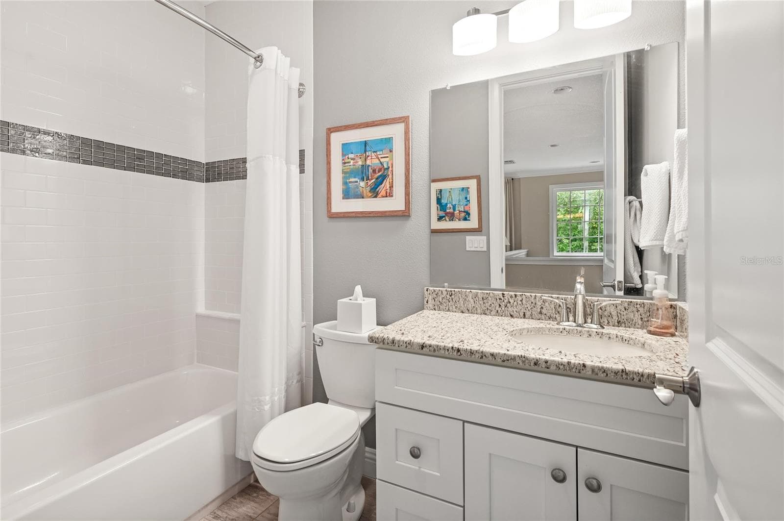 This full bath is adjacent to the loft and convenient to the third upstairs bedroom. - 1951 WINTER PARK RD, WINTER PARK