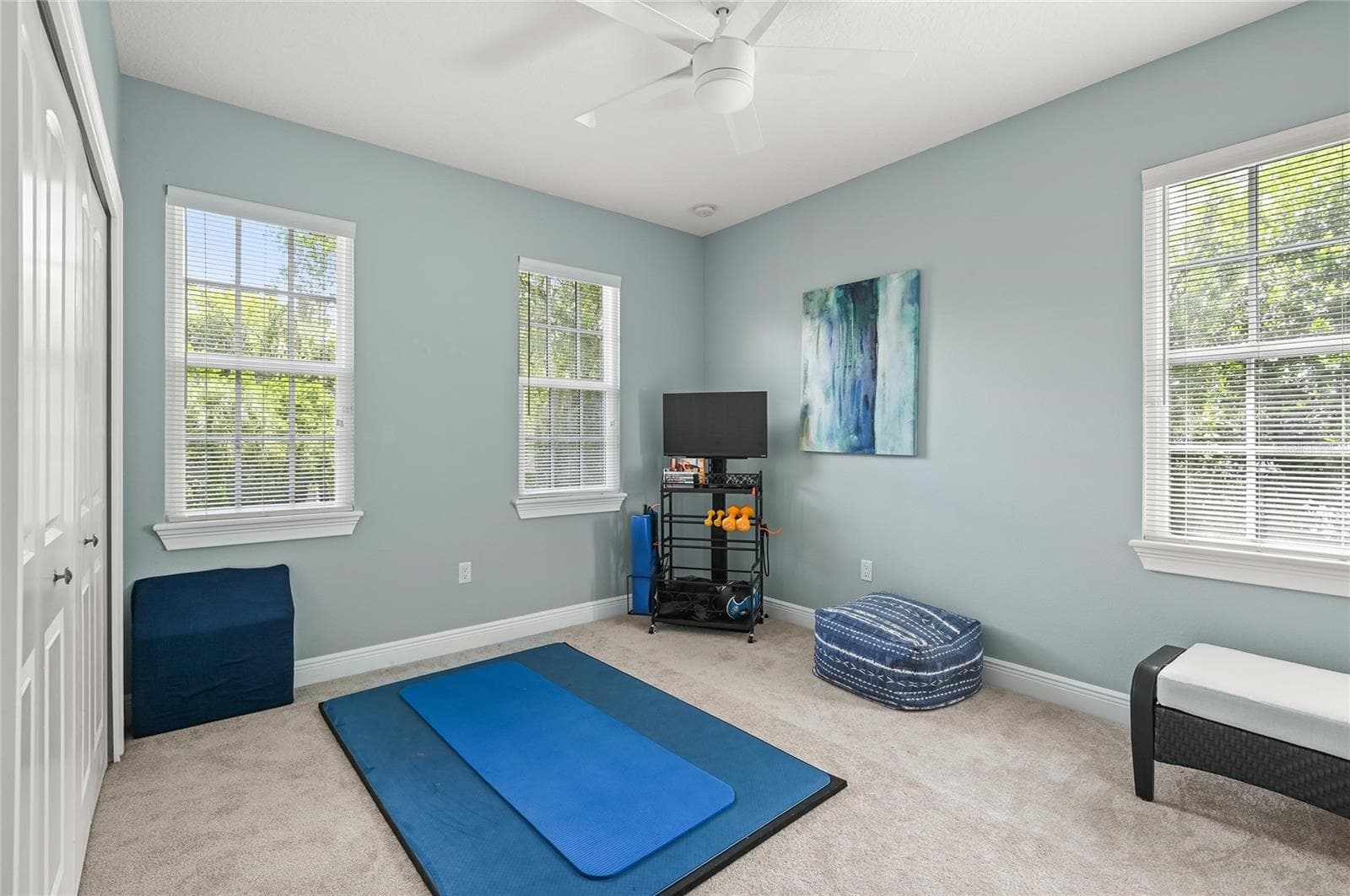 Currently used as an exercise room, this bedroom has some of the nicest morning light, and plenty of room for bedroom furnishings or an office. - 1951 WINTER PARK RD, WINTER PARK