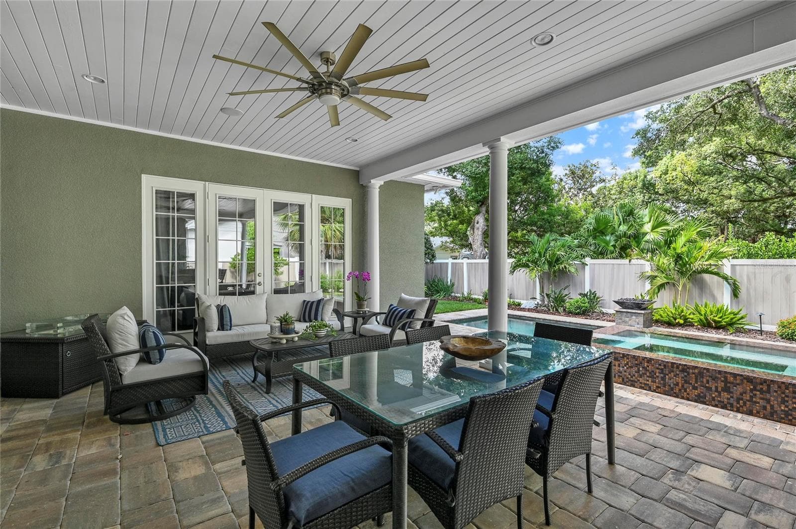 Meals at the outdoor table come with a show-stopping view to the private backyard oasis. - 1951 WINTER PARK RD, WINTER PARK