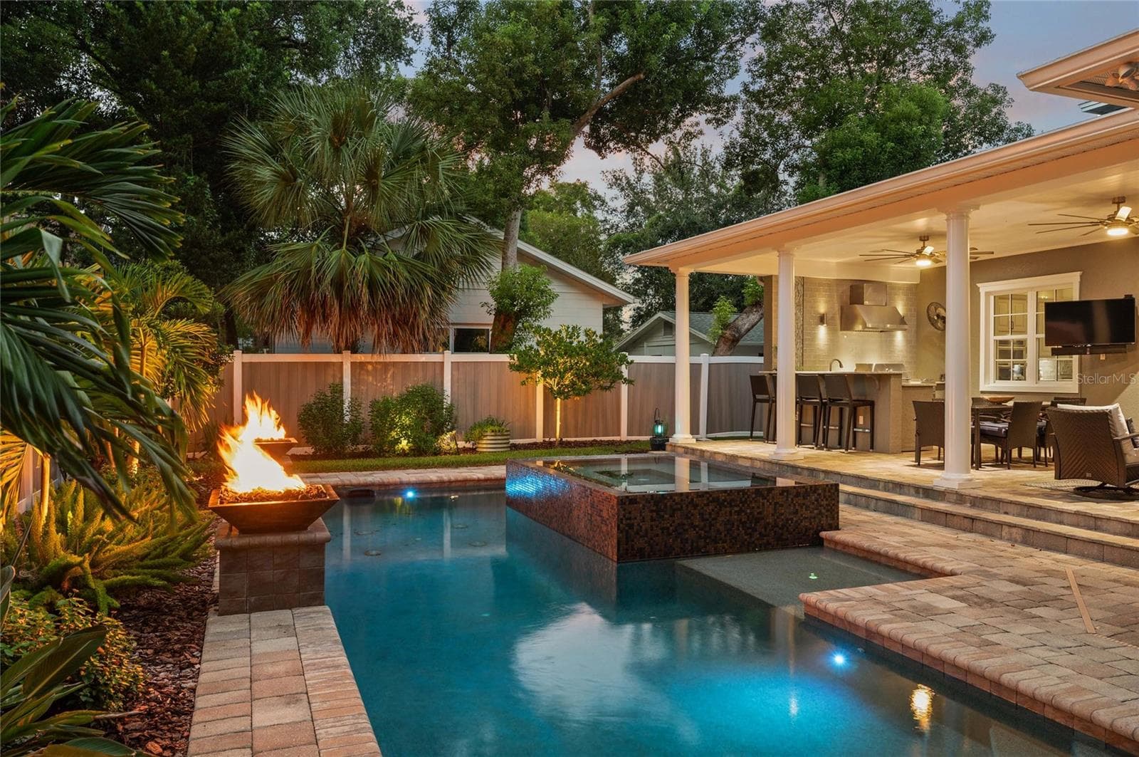 Two beach areas with bubblers flank the spa. - 1951 WINTER PARK RD, WINTER PARK