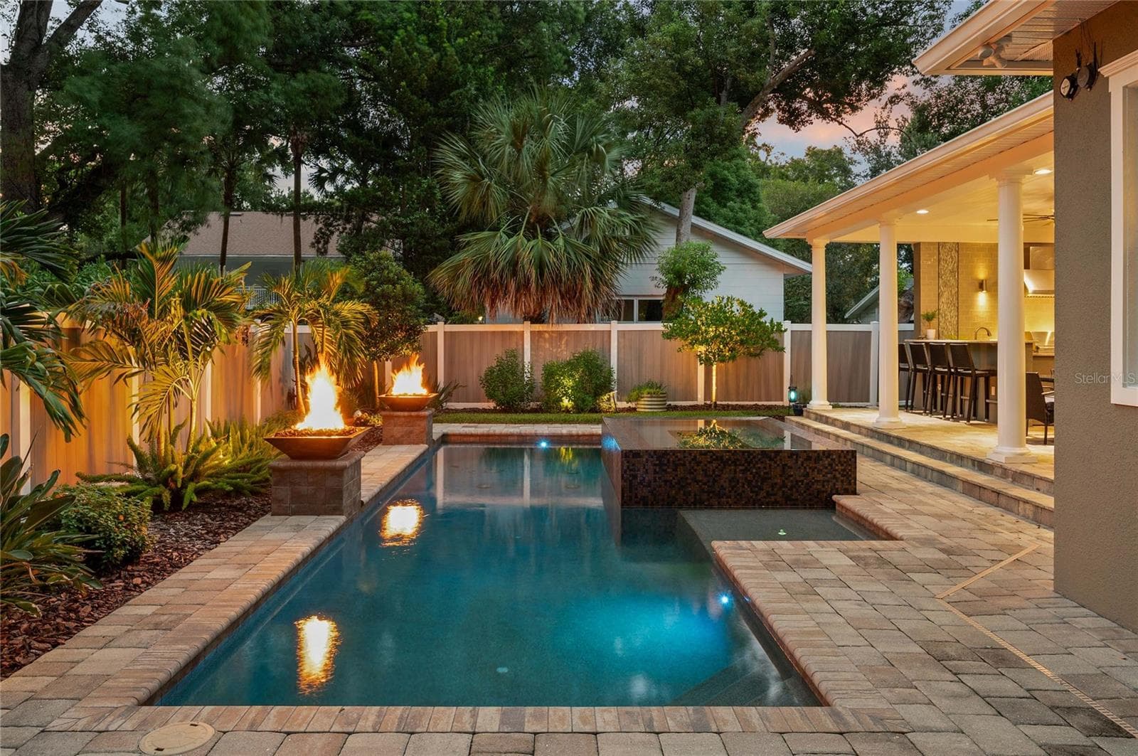 Lovely pavers flow from the patio to the deck for a finished look. - 1951 WINTER PARK RD, WINTER PARK