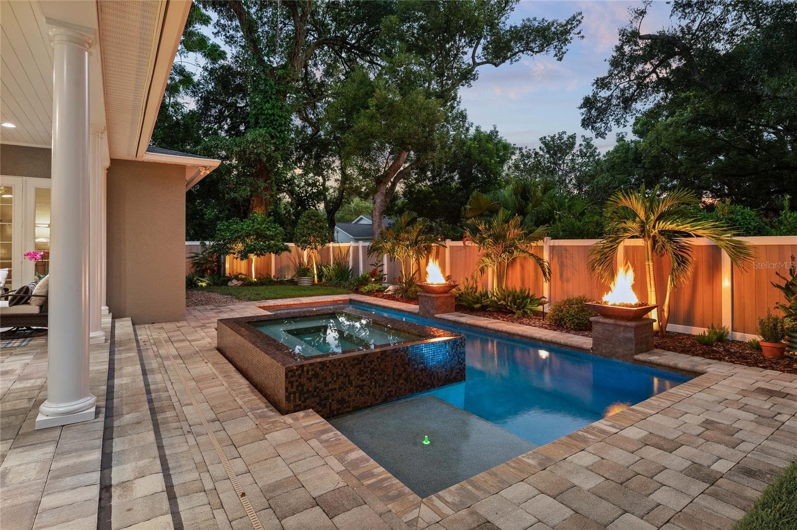 Landscape lighting creates a cozy, relaxing atmosphere at nightfall. - 1951 WINTER PARK RD, WINTER PARK