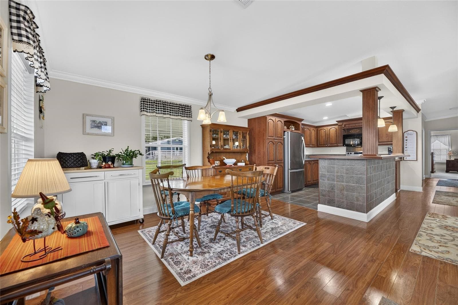 spacious, lovely wood flooring, take a seat - 10054 COLLINGWOOD AVE, DADE CITY