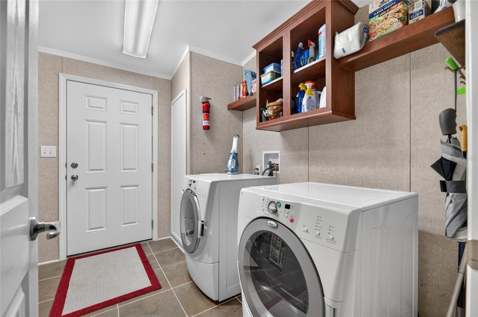 laundry room with outside access to ramp - 10054 COLLINGWOOD AVE, DADE CITY