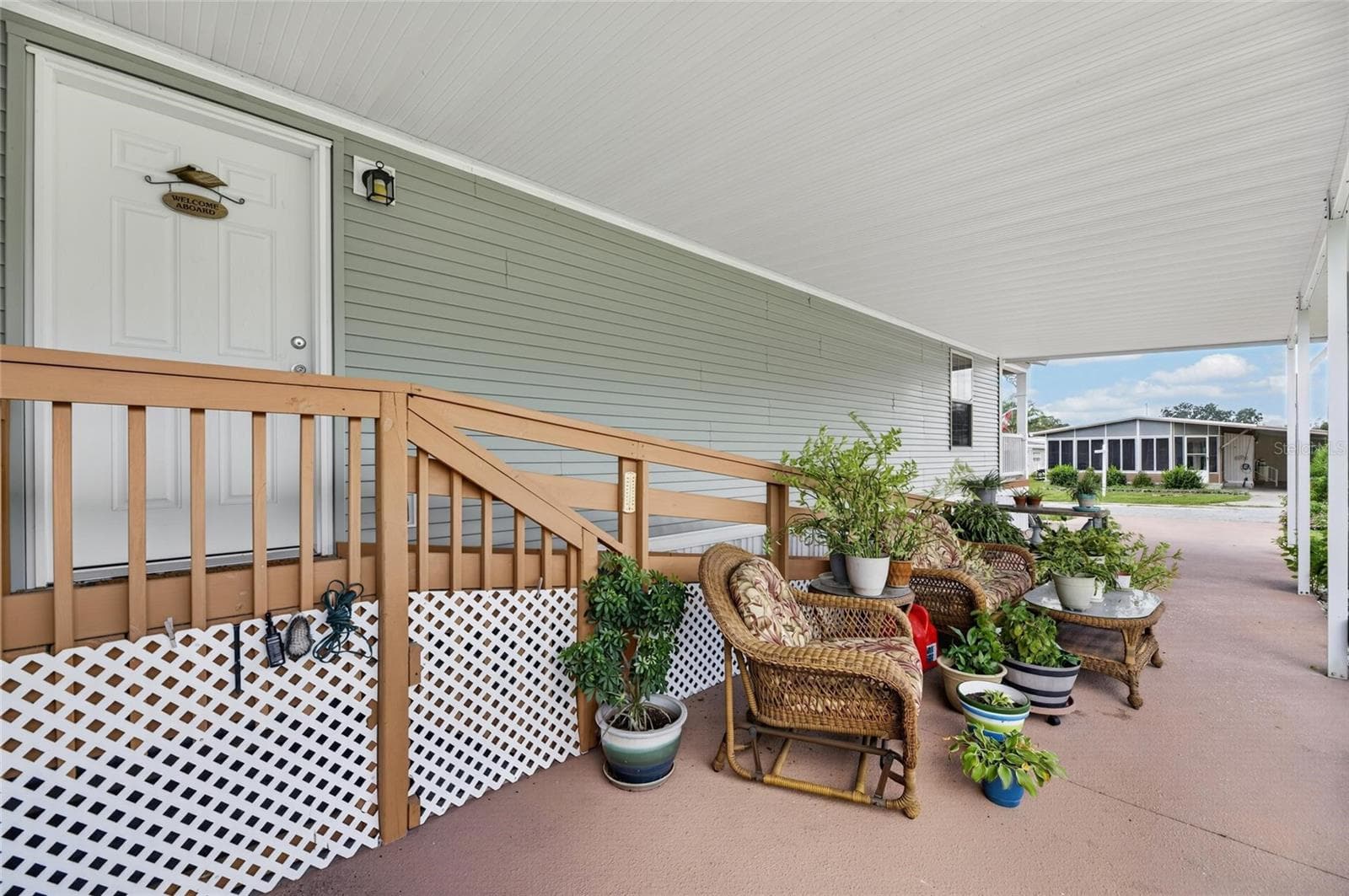 plenty of space to relax in the shade of the carport - 10054 COLLINGWOOD AVE, DADE CITY