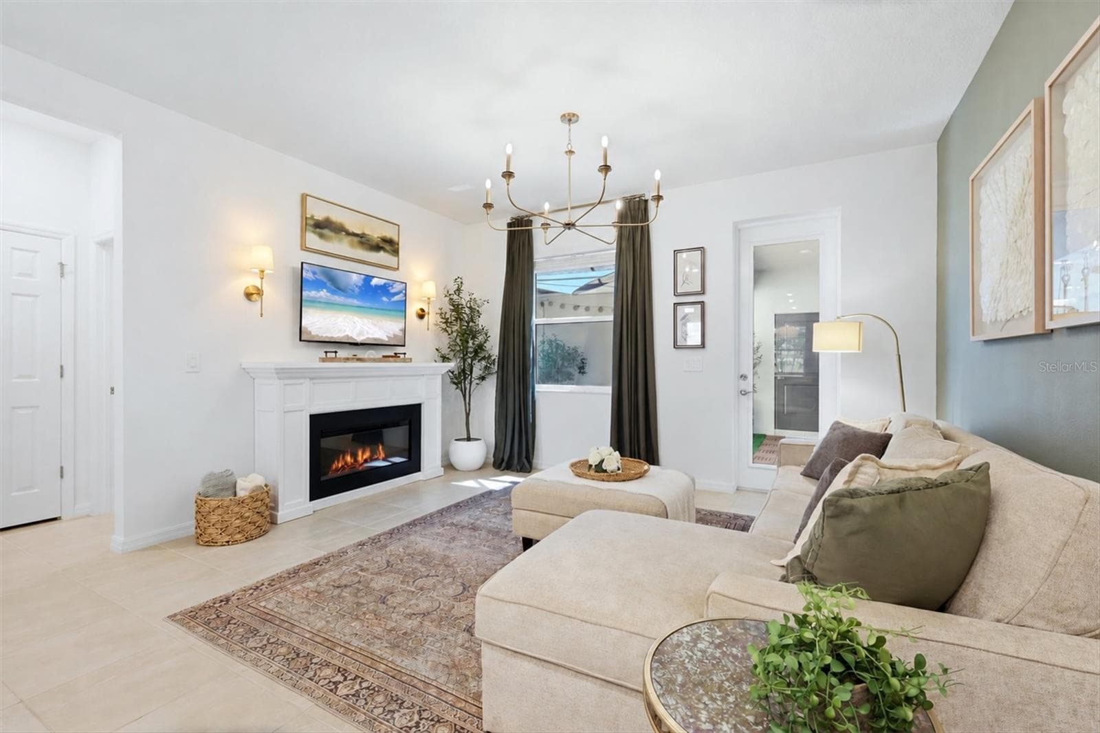 Great room with access to the lanai and courtyard. - 7392 CABIN LN, SARASOTA
