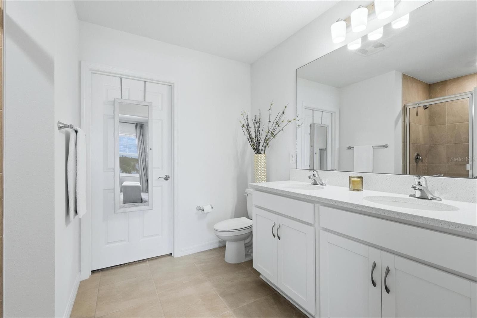 Primary bath suite with walk-in closet and shower - 7392 CABIN LN, SARASOTA